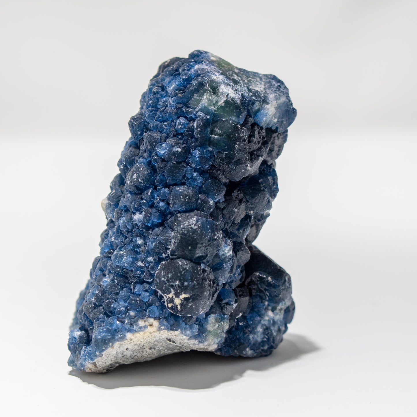 Blue mineral rock on a white background