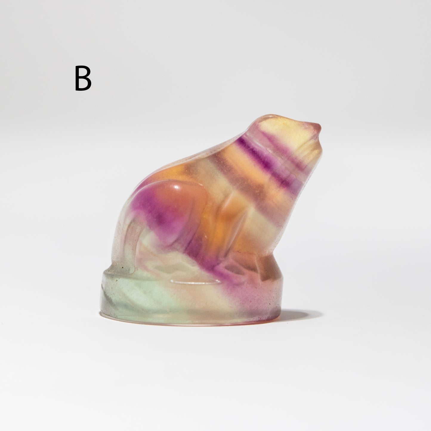 Multicolored crystal sculpture on a white background