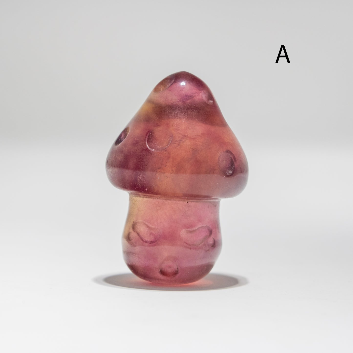 Fluorite mushroom-shaped object on a white background