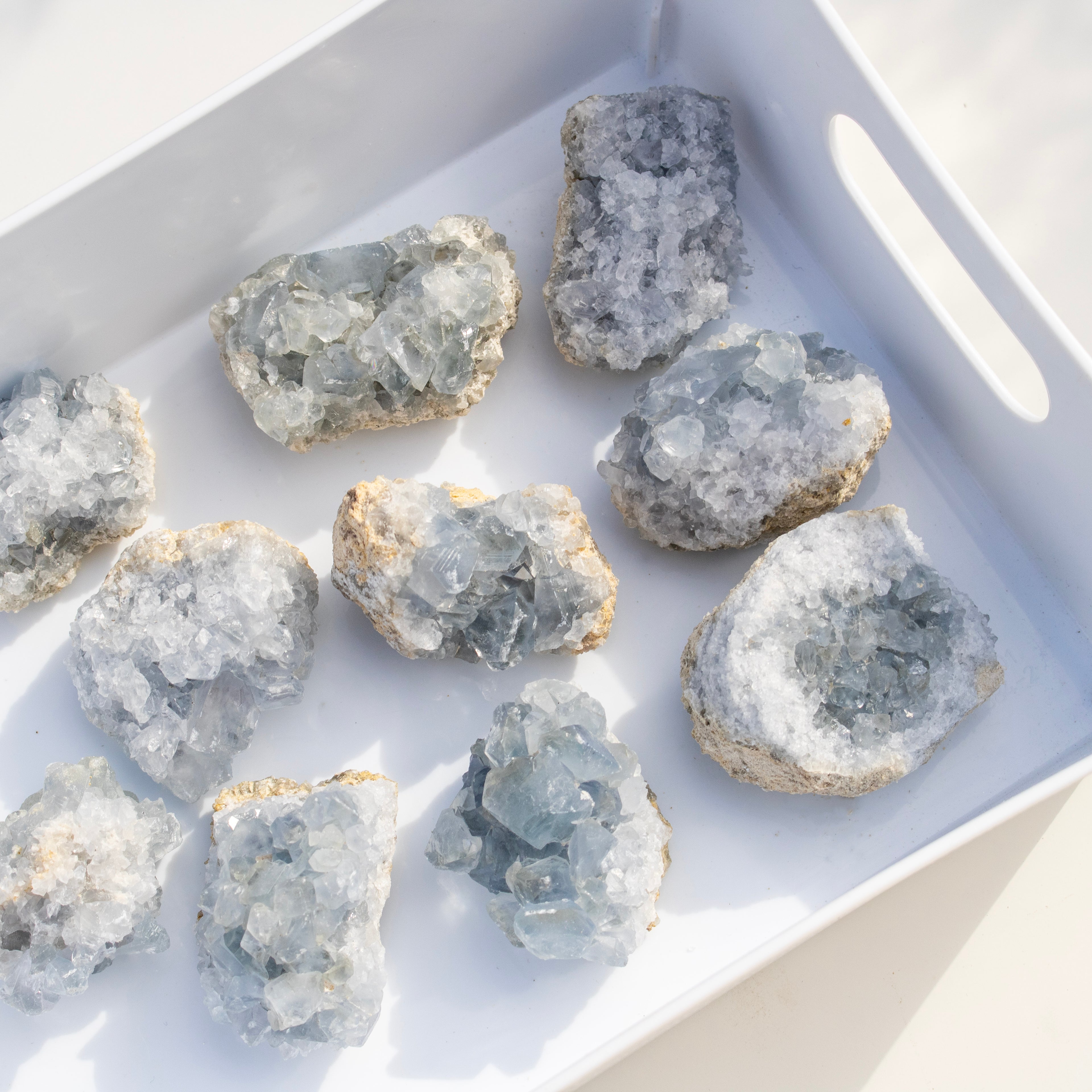 Geode crystals on a white tray