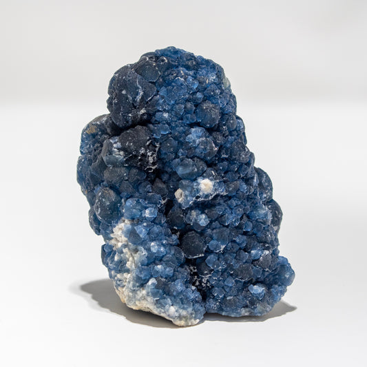 Blue crystal cluster on a white background