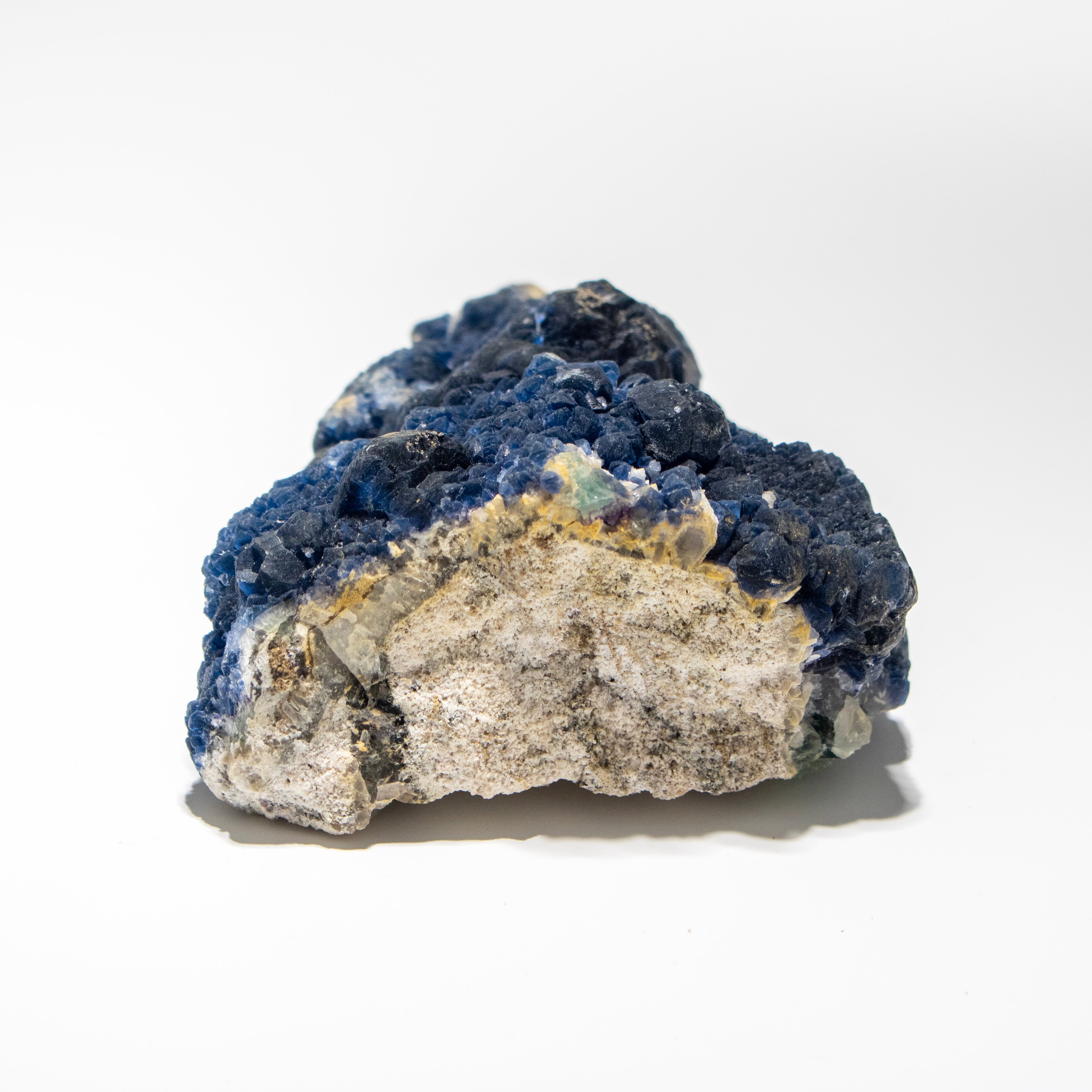 Mineral sample with blue and gray colors on a white background