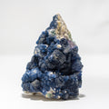 Blue mineral cluster on a white background