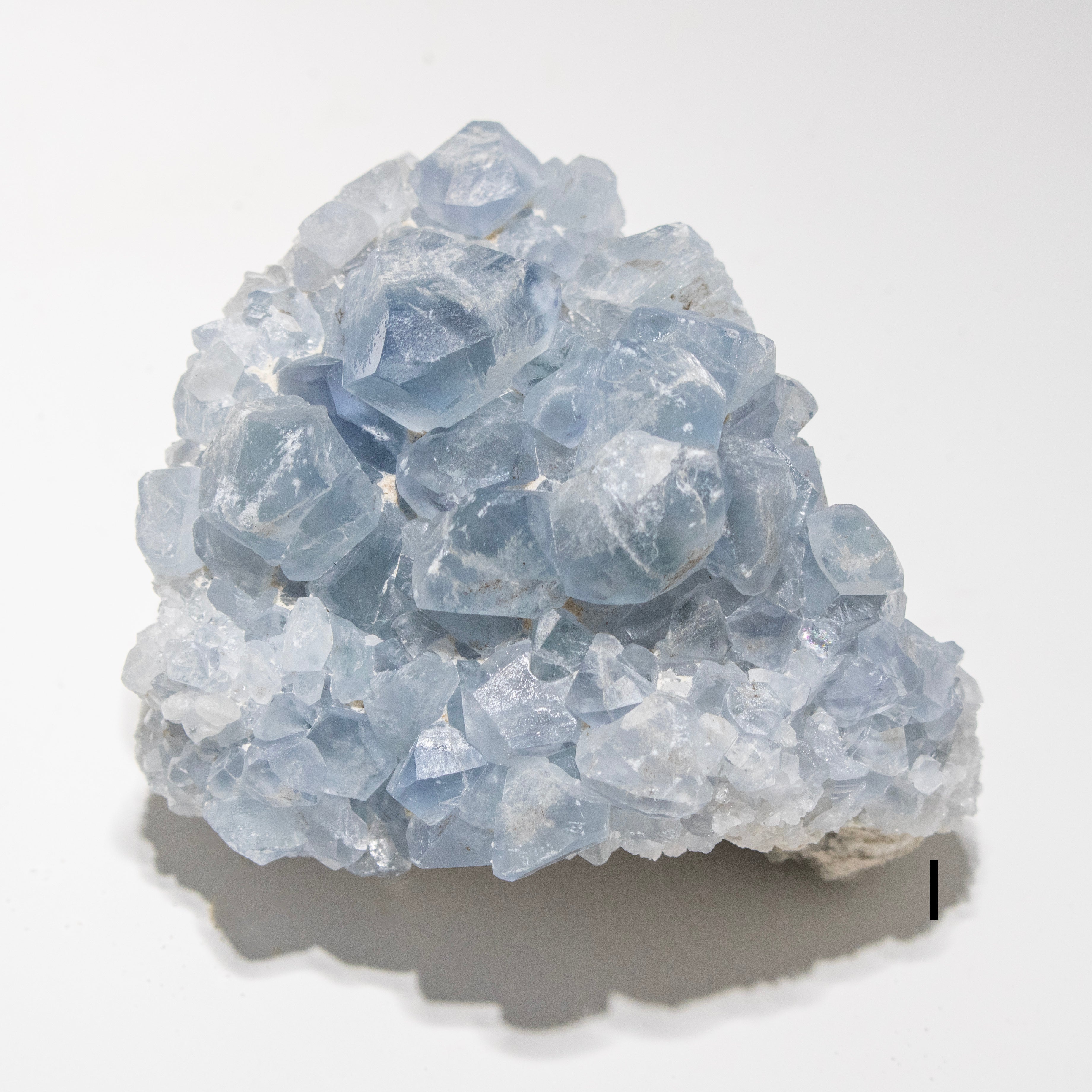 Cluster of blue crystals on a white background