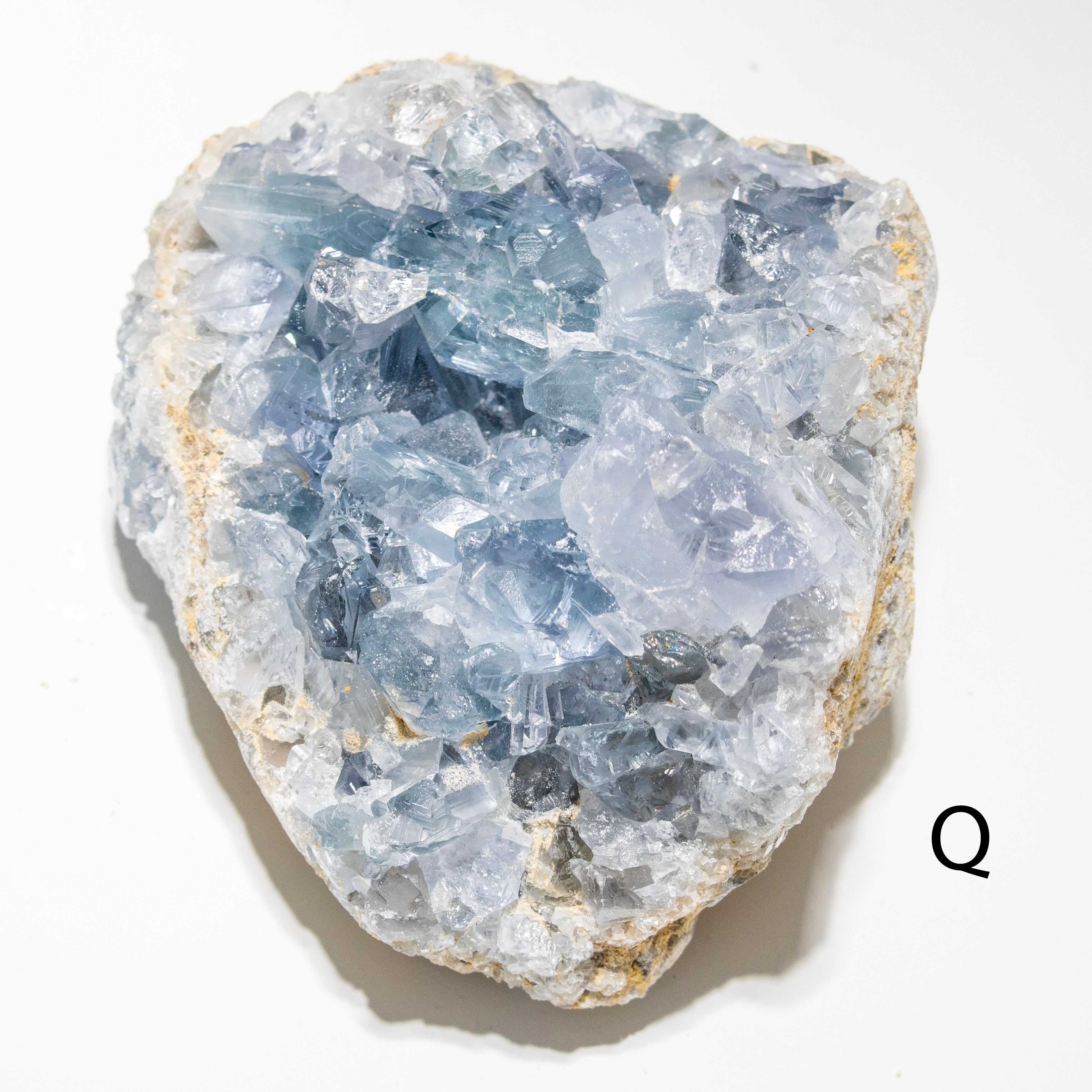 Crystal rock with blue and white crystals on a white background