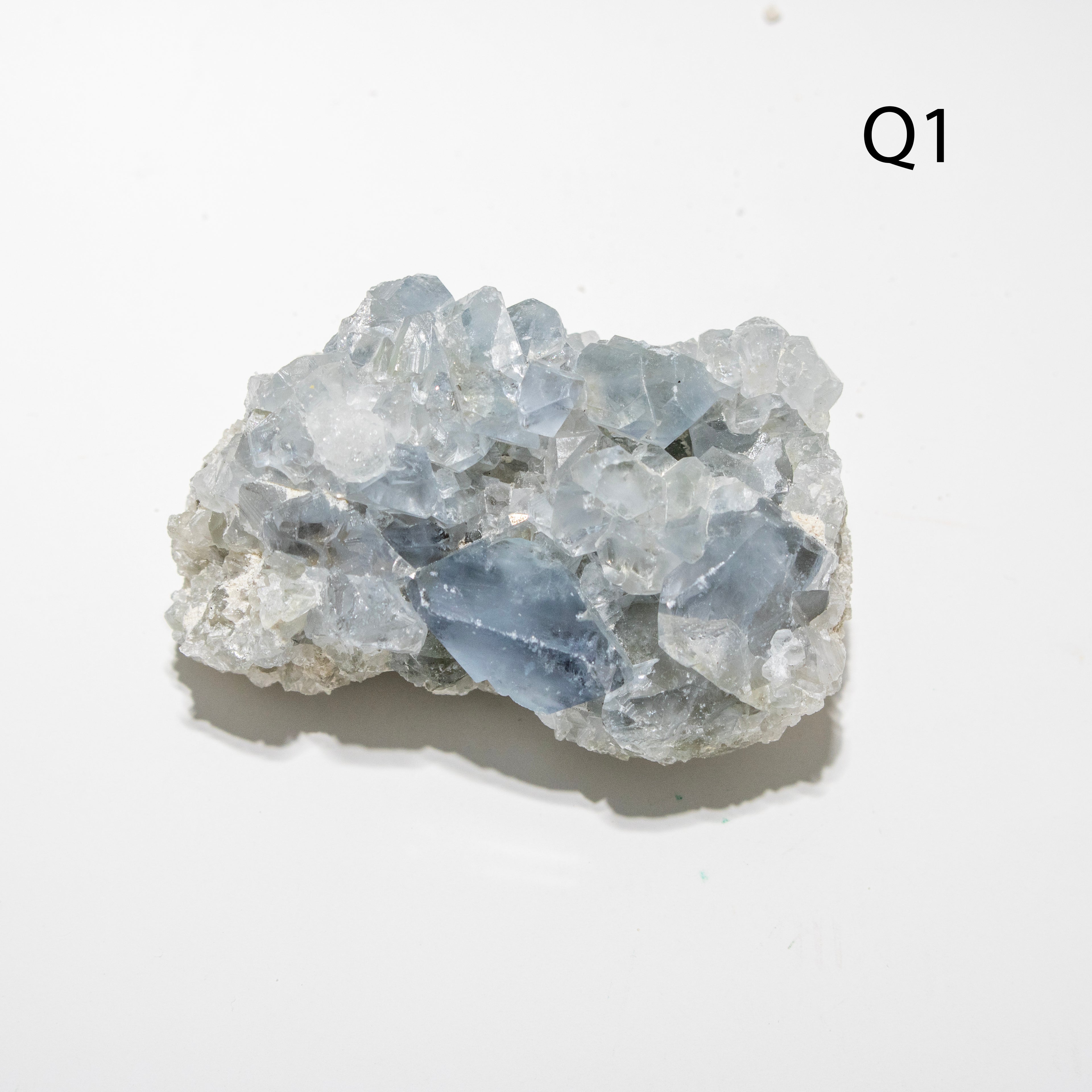 Crystal rock on a white background with 'Q1' label