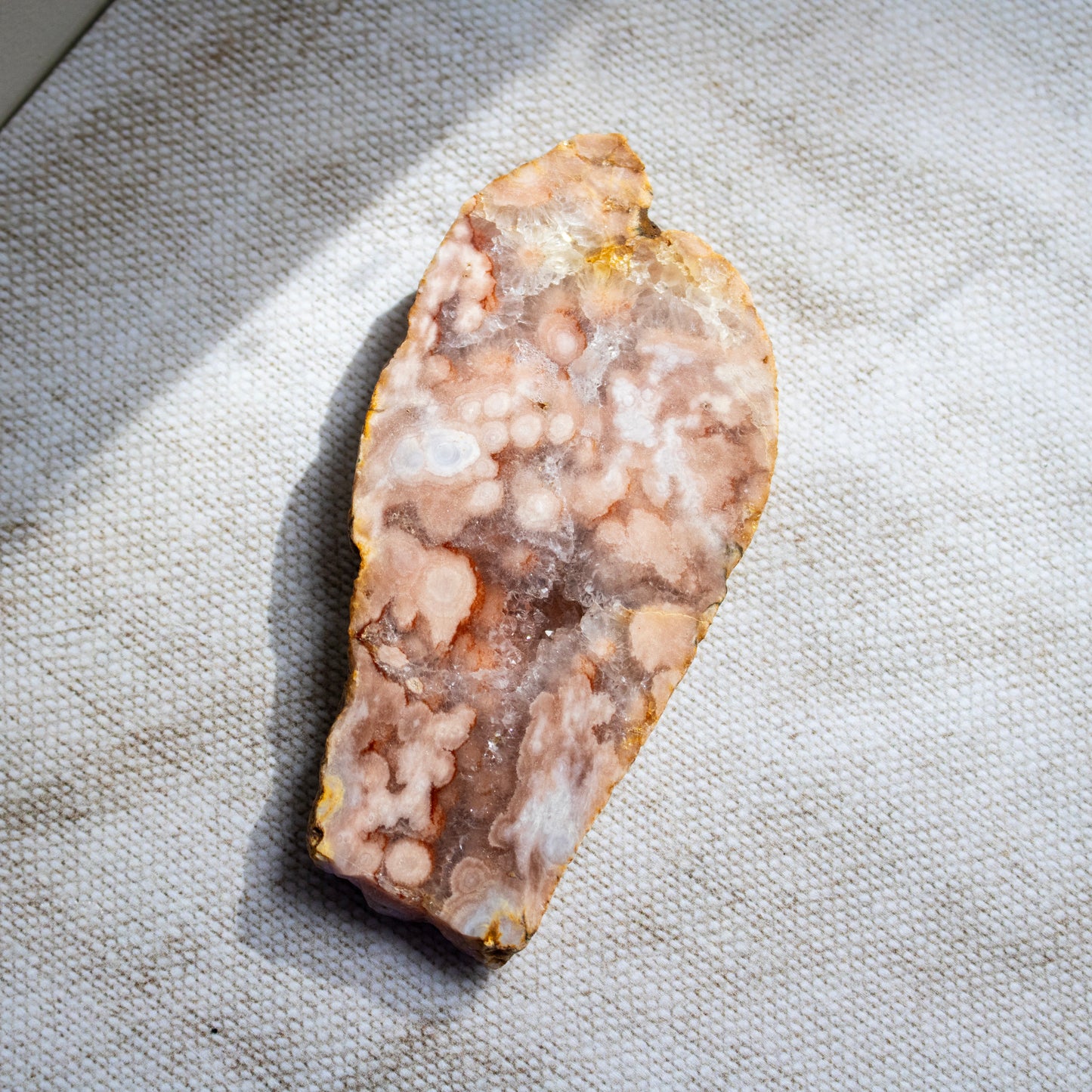 Geode crystal on a textured fabric background