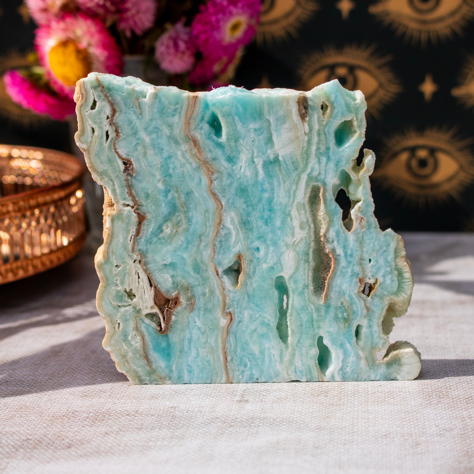 Decorative stone with blue and brown marbled pattern on a light surface
