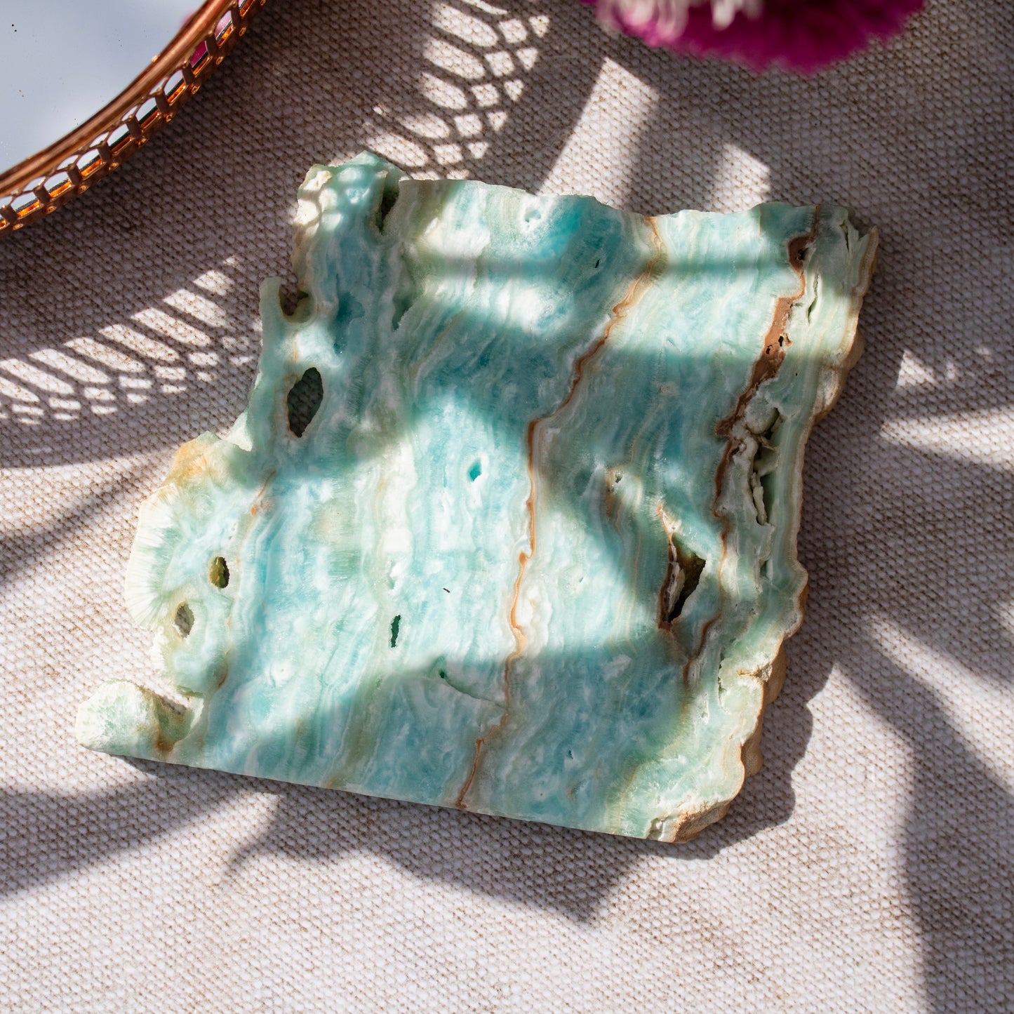 Decorative crystal tile with textured surface on a fabric background