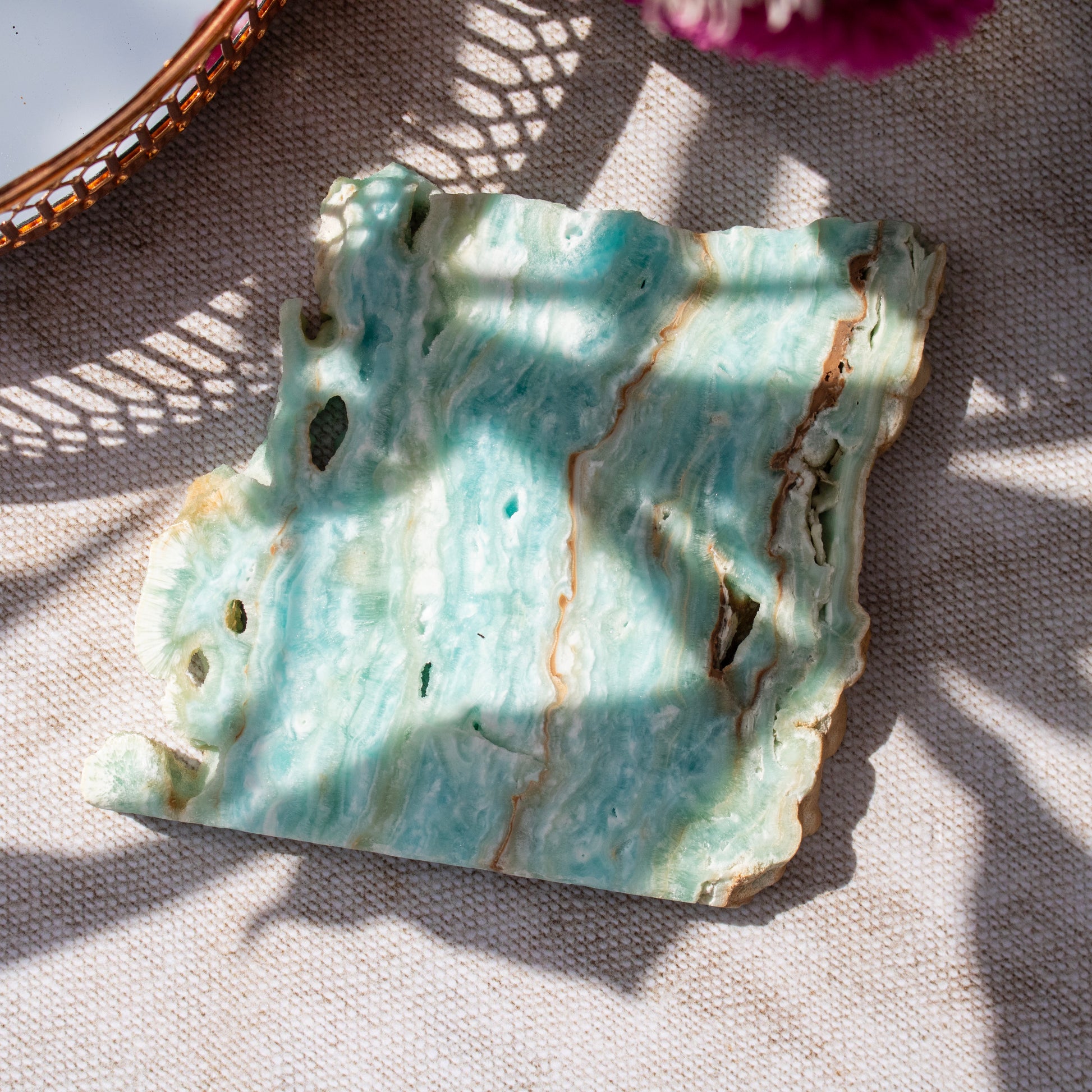 Decorative crystal tile with textured surface on a fabric background