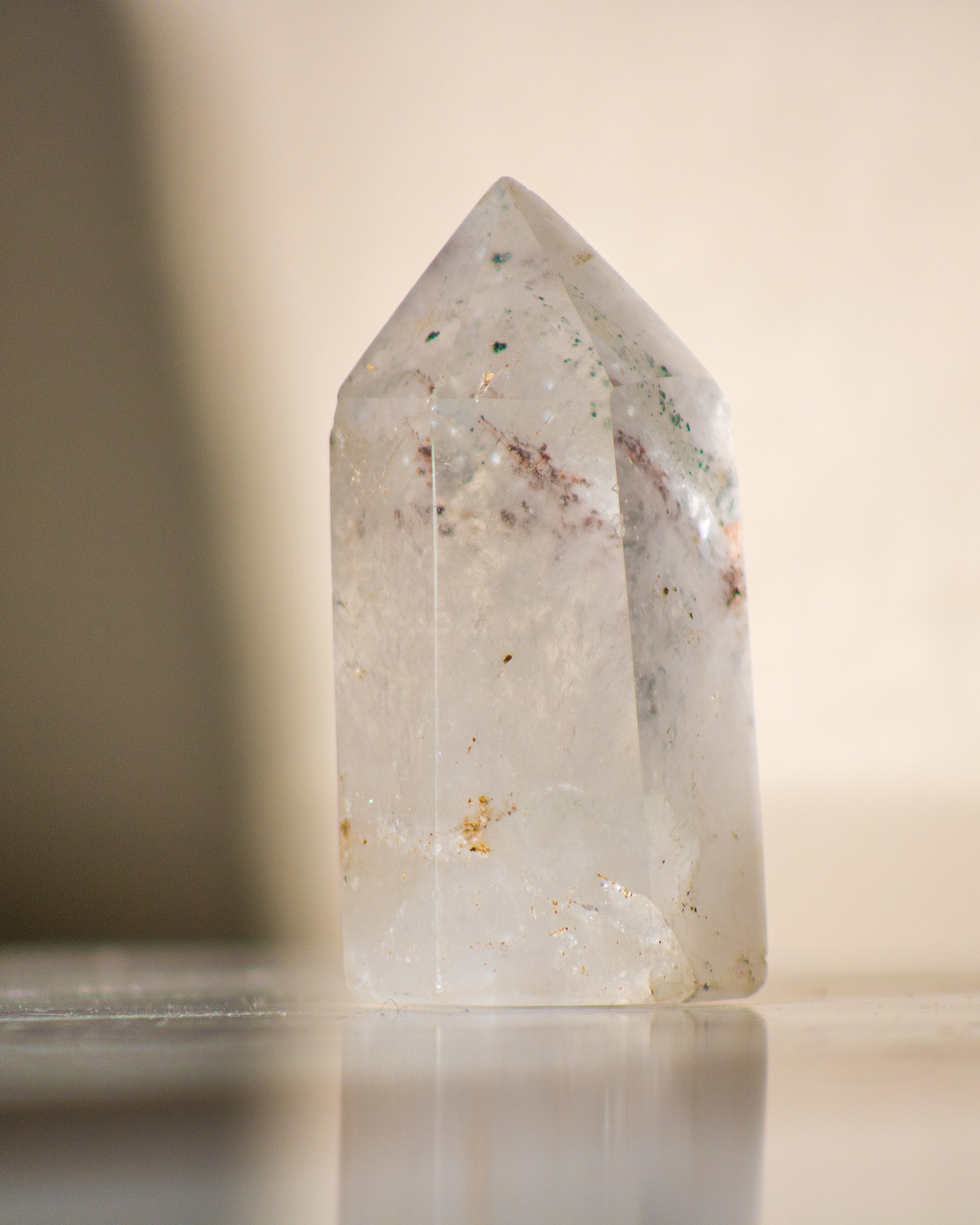 a clear quartz tower on a neutral background