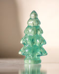 a green pine tree shaped crystal