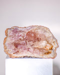 a small pink stone geode cluster