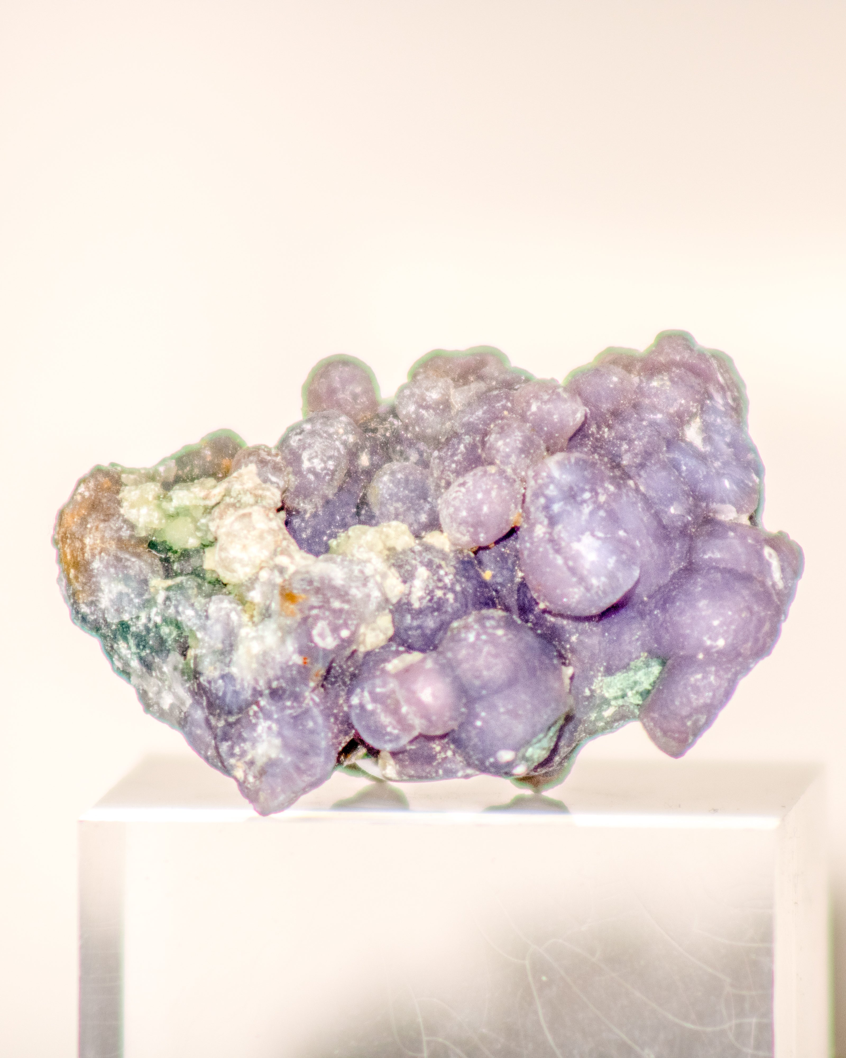 Purple crystal cluster on a white background