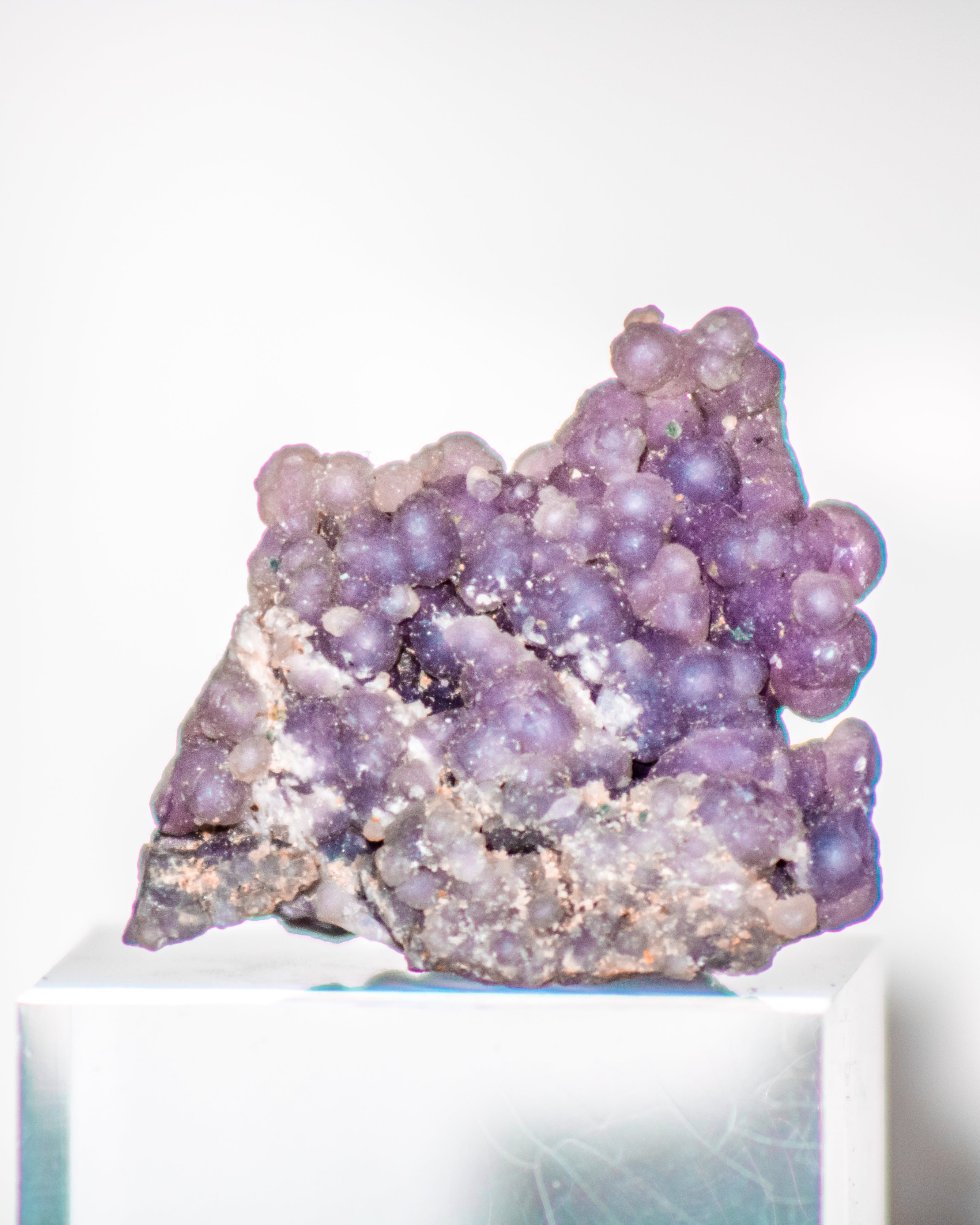 Purple crystal cluster on a white background