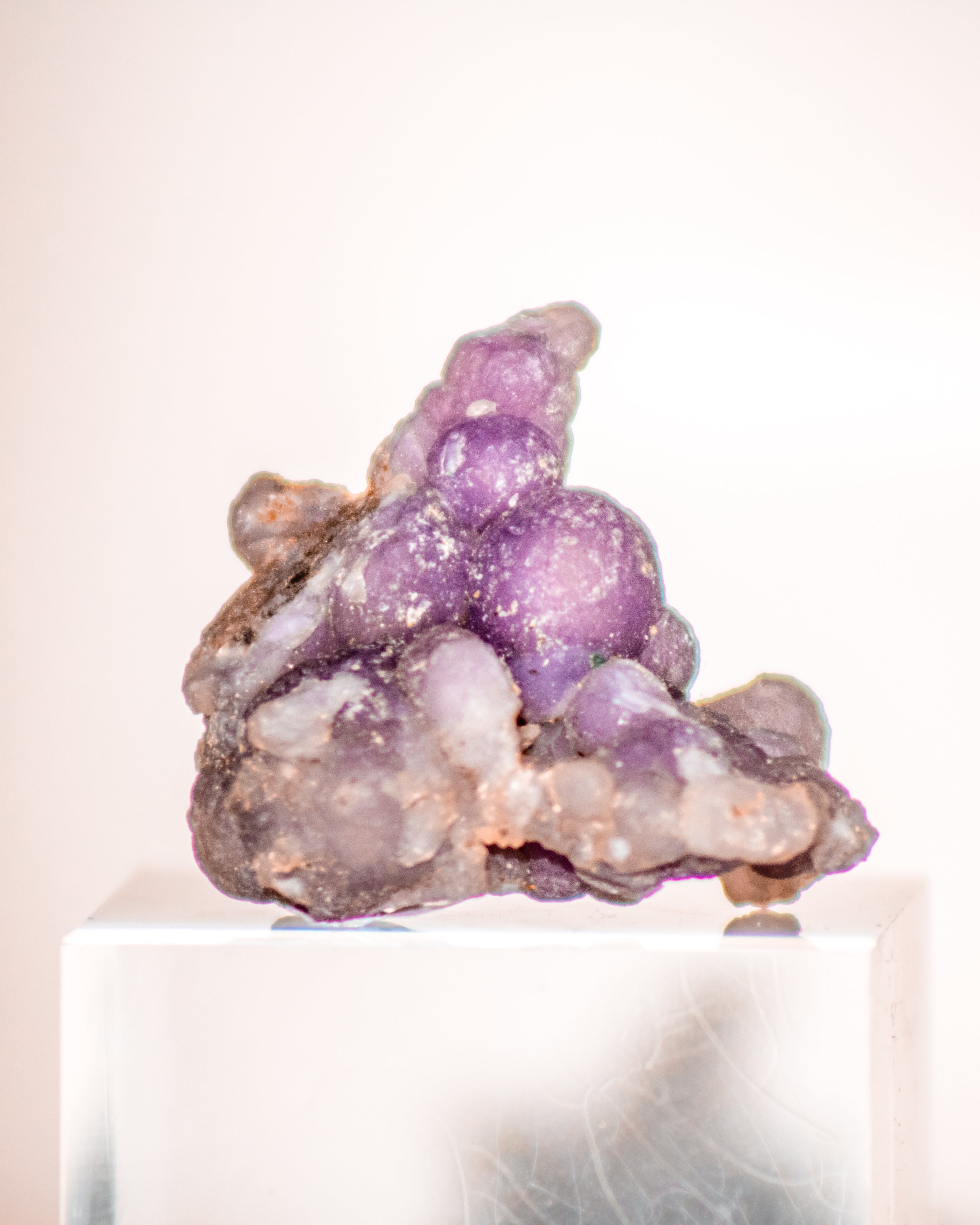 Purple crystal cluster on a white background