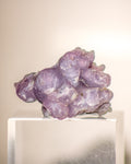 Purple crystal cluster on a white background