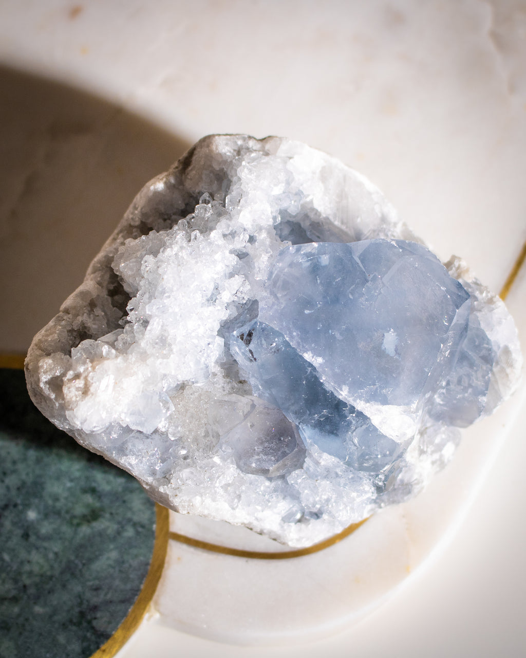 Crystal rock with blue and white colors on a neutral background