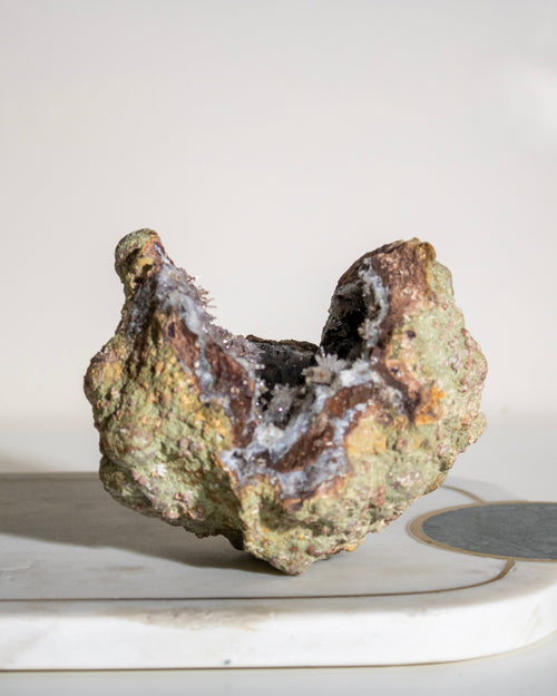 a large geode crystal on a plain background