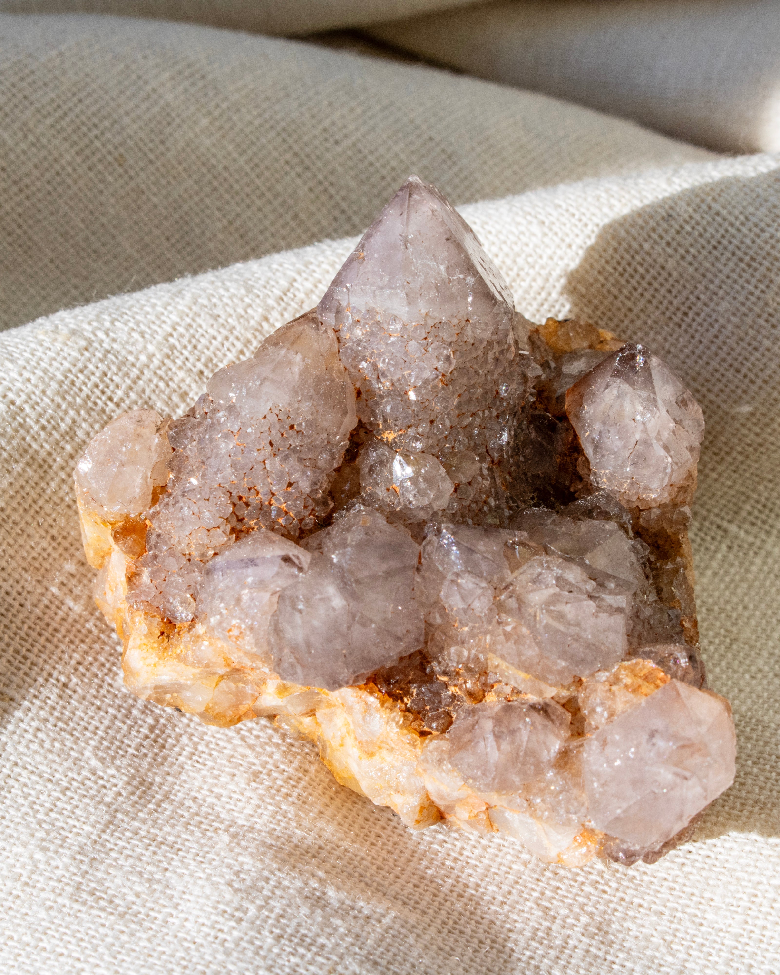 Crystal rock on a textured beige fabric background