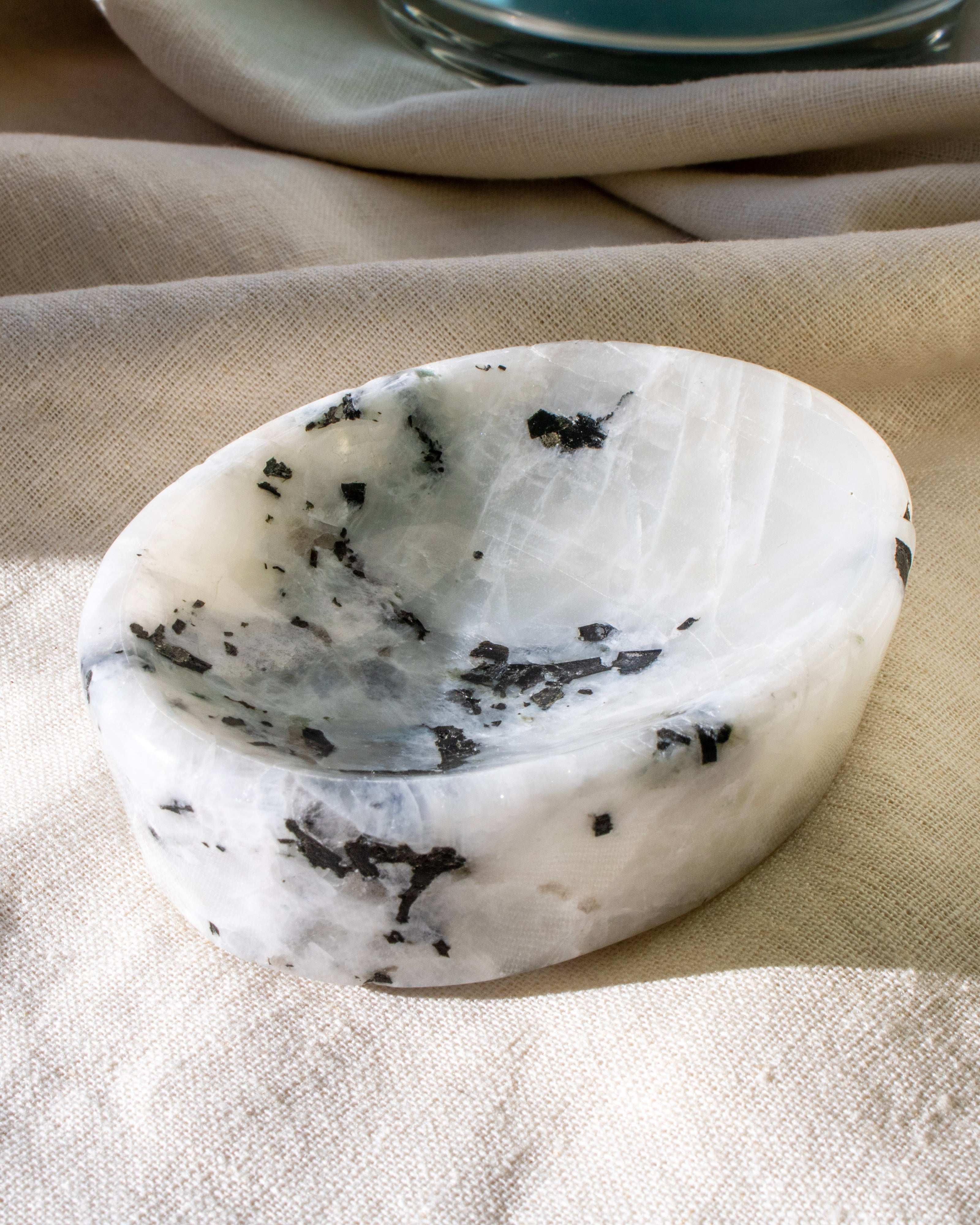 a shallow white dish on a plain background