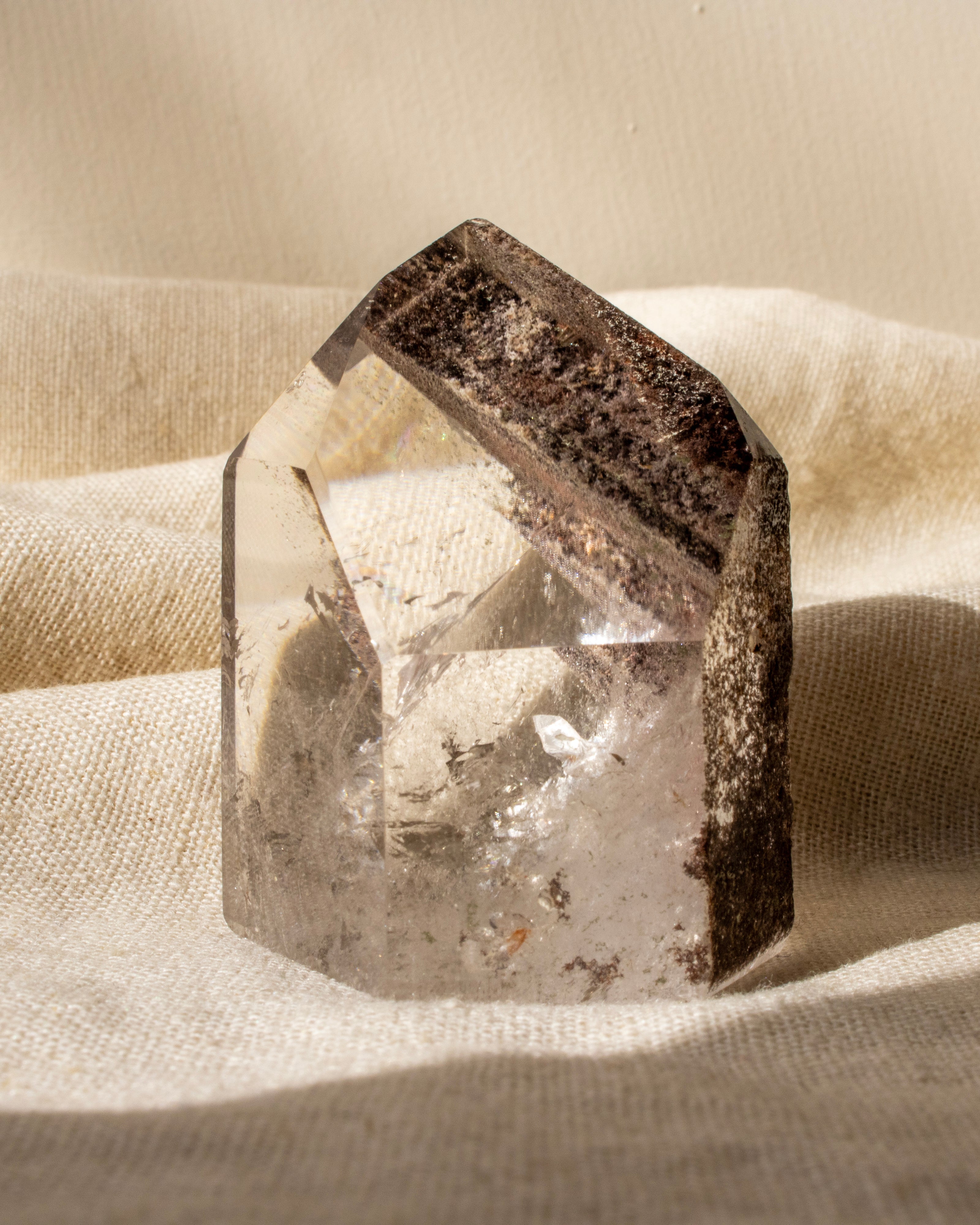 garden quartz crystal on a textured beige surface