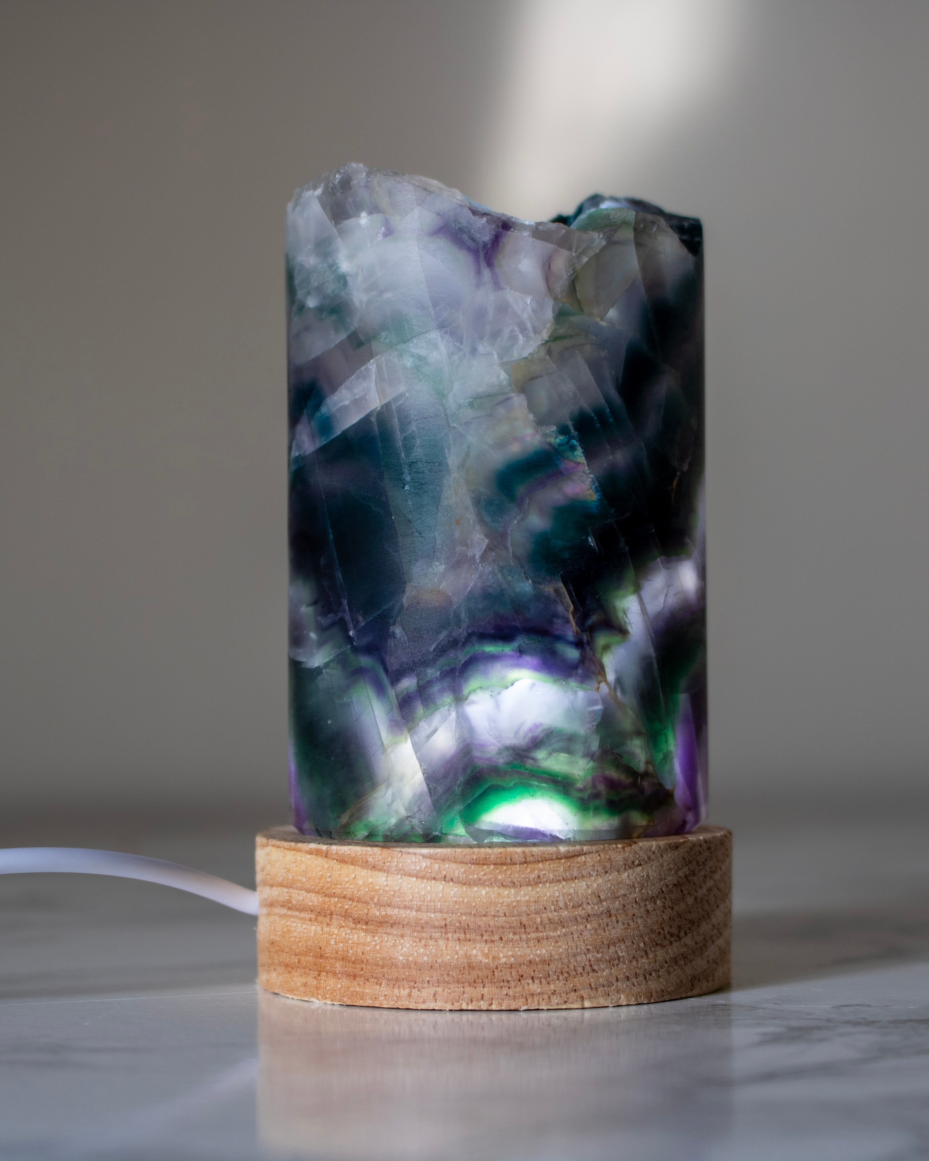 Decorative lamp with a natural stone design on a wooden base