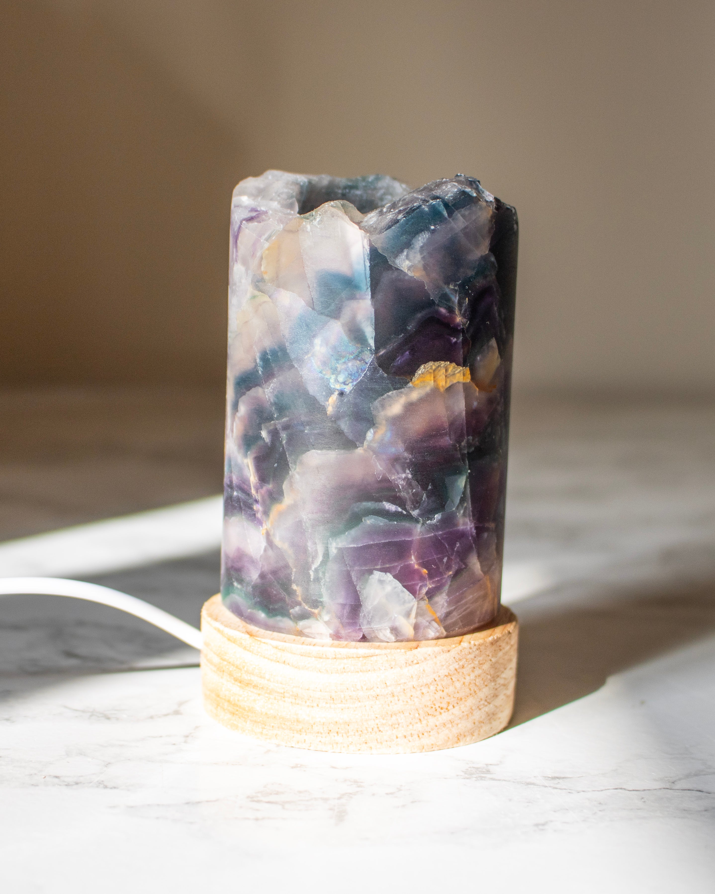 Decorative lamp with a natural stone design on a light surface.