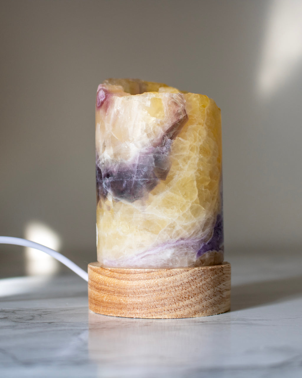 Decorative lamp with a natural stone design on a marble surface