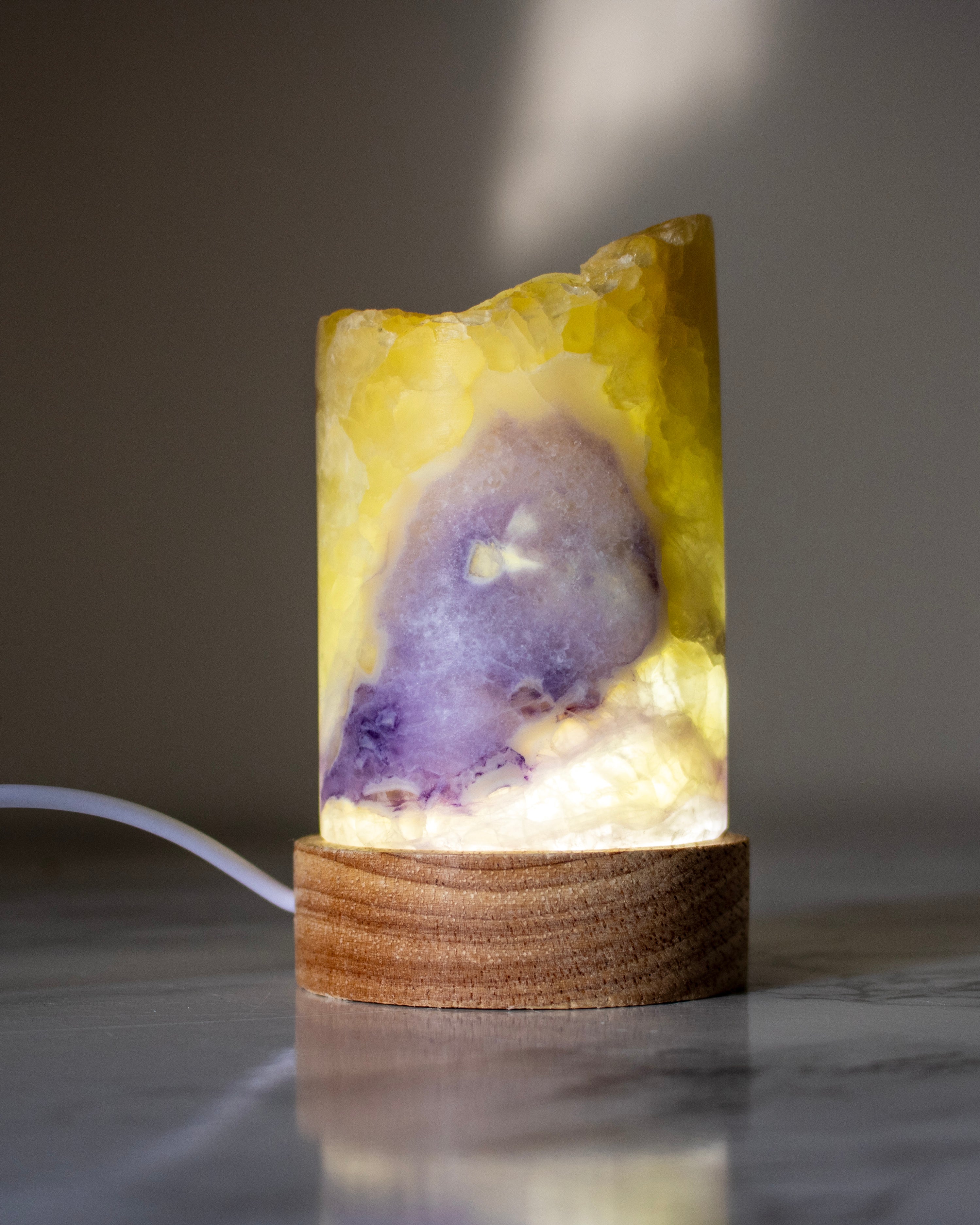 Decorative lamp with a natural stone design on a marble surface