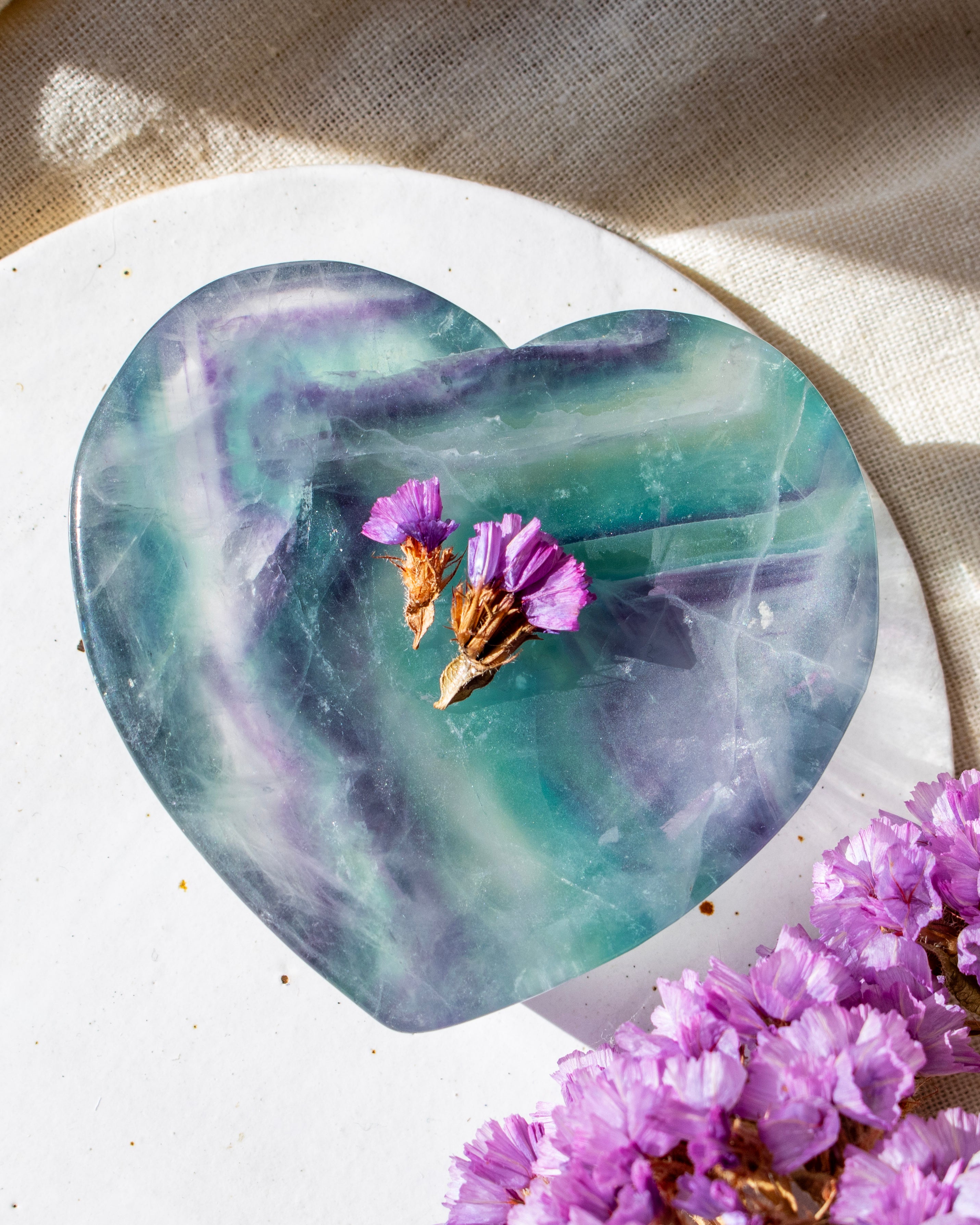 green and purple stone heart with purple flowers