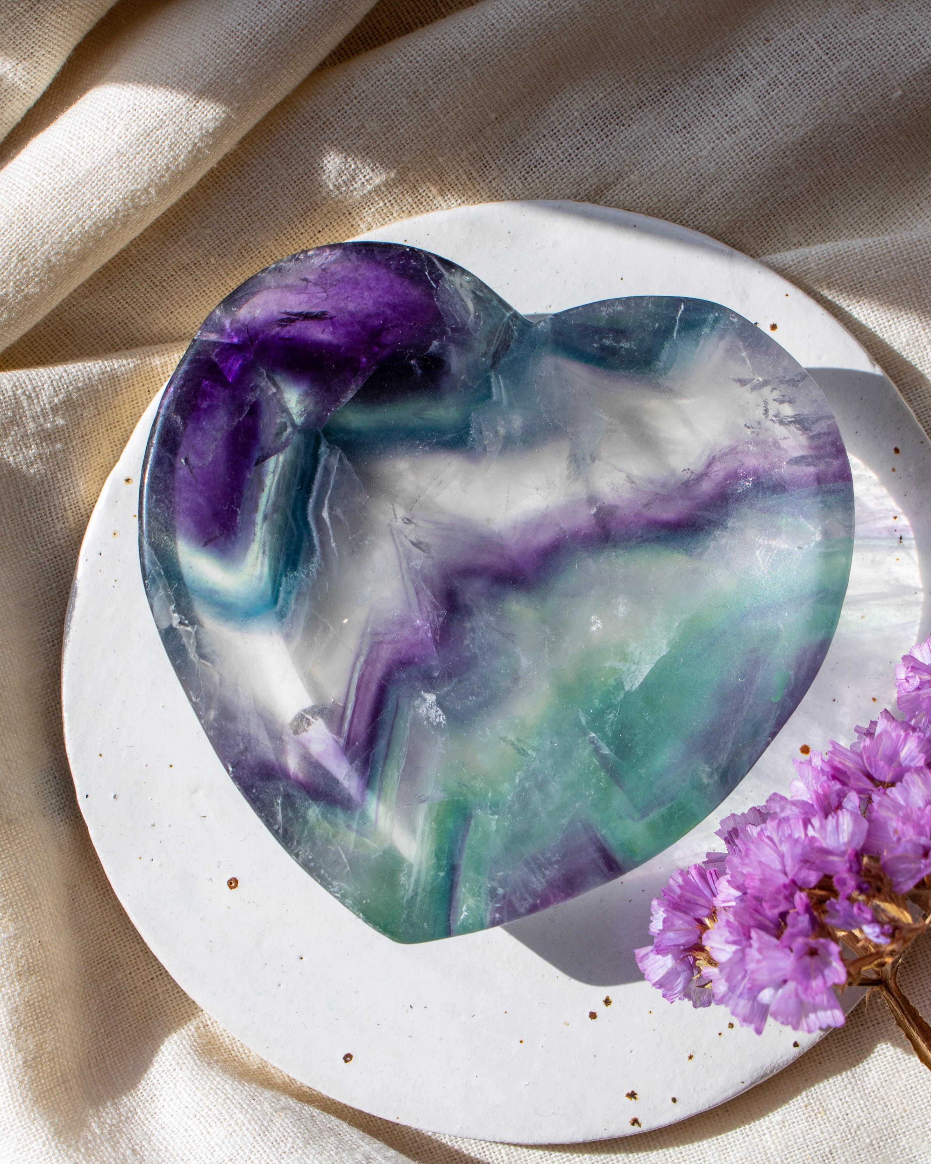green and purple stone heart with purple flowers