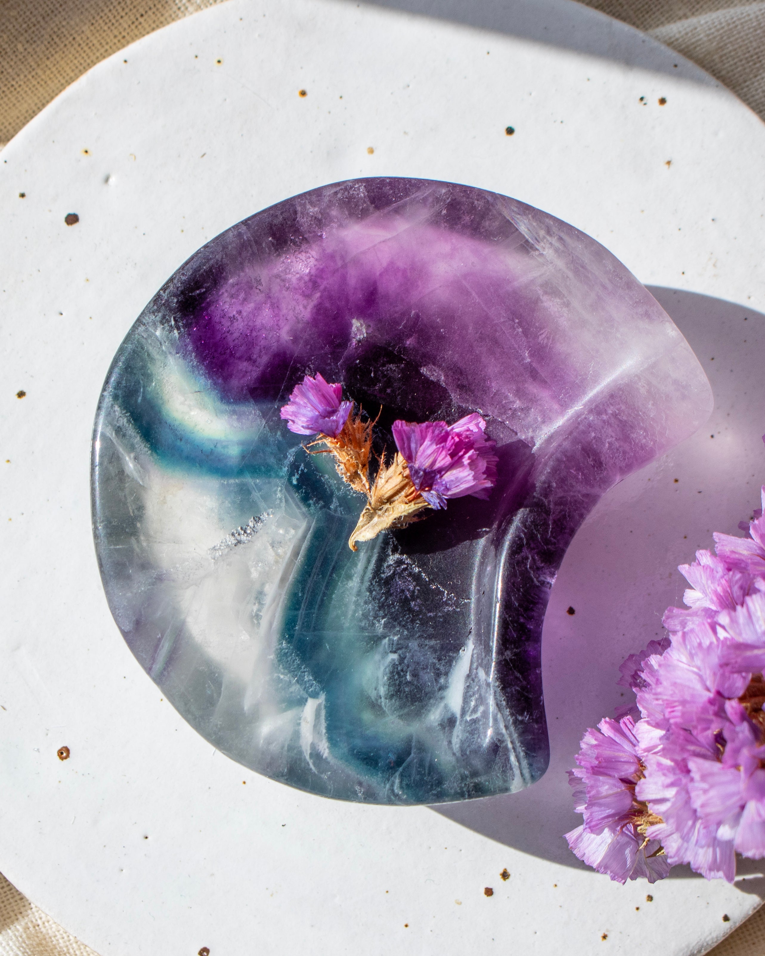 green and purple stone moon with purple flowers