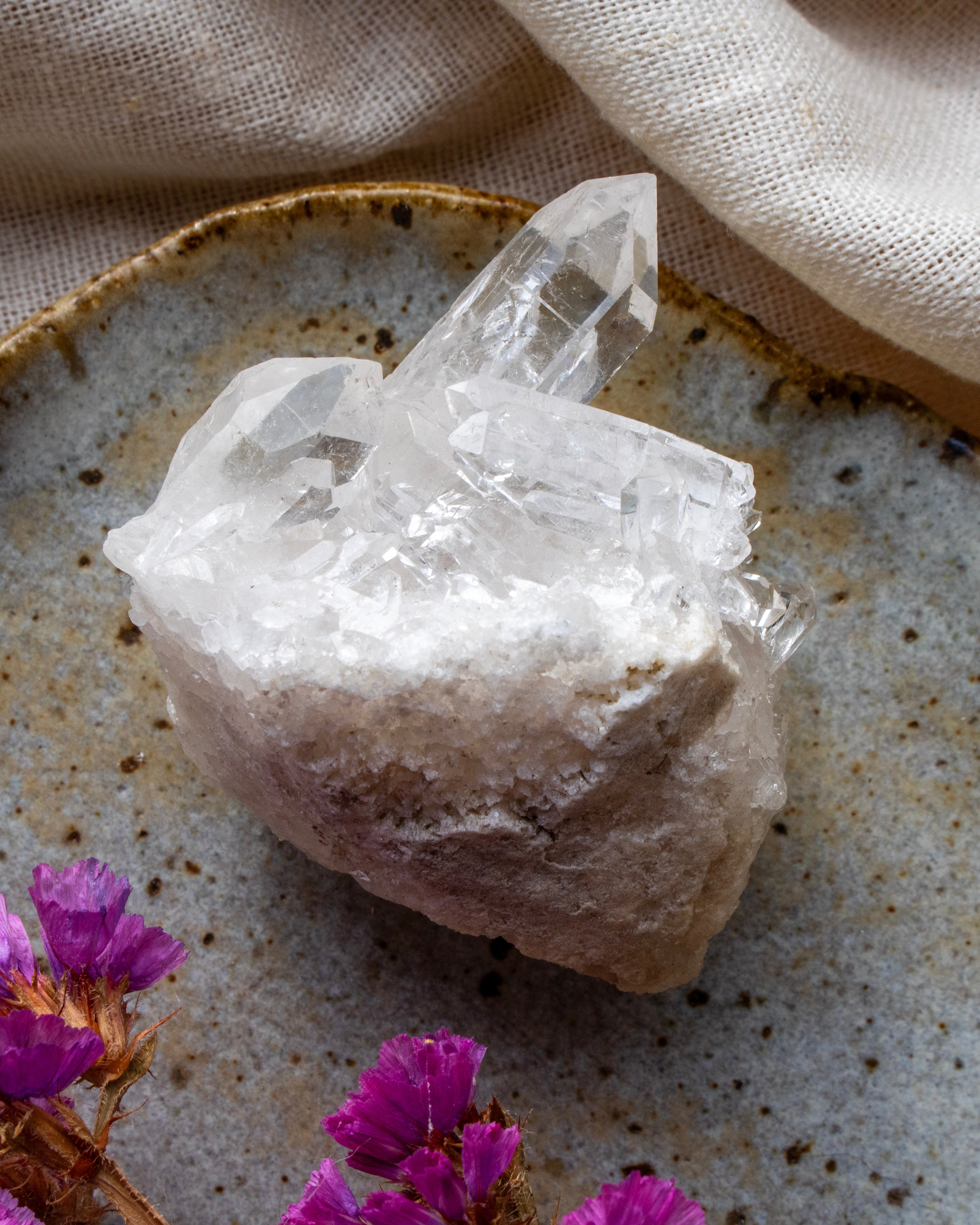 Crystal formation on a textured surface with purple flowers