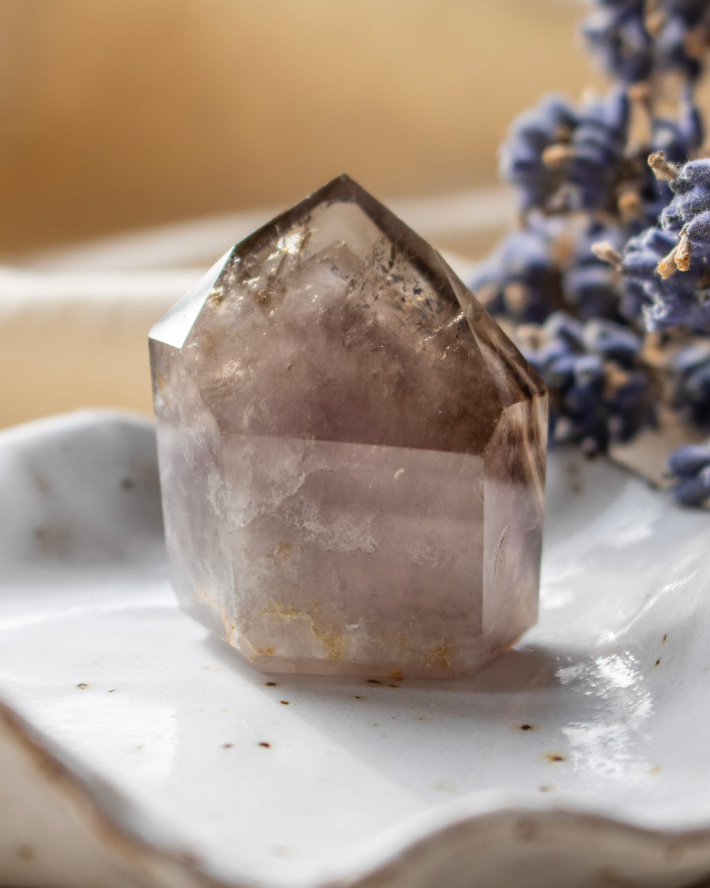 Crystal on a marble surface with a blurred background