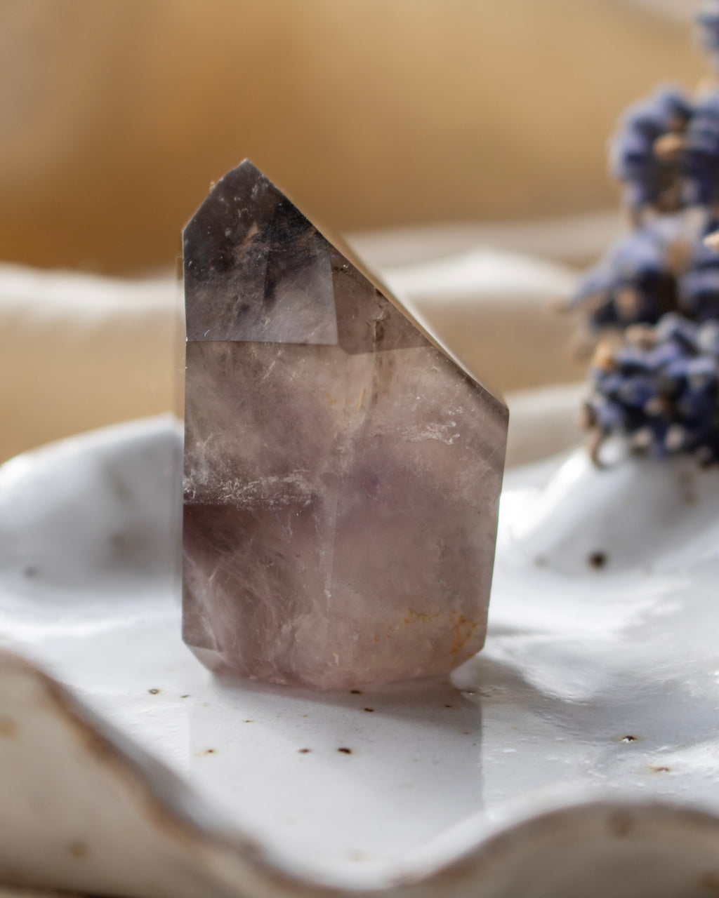 Crystal on a white surface with a blurred background