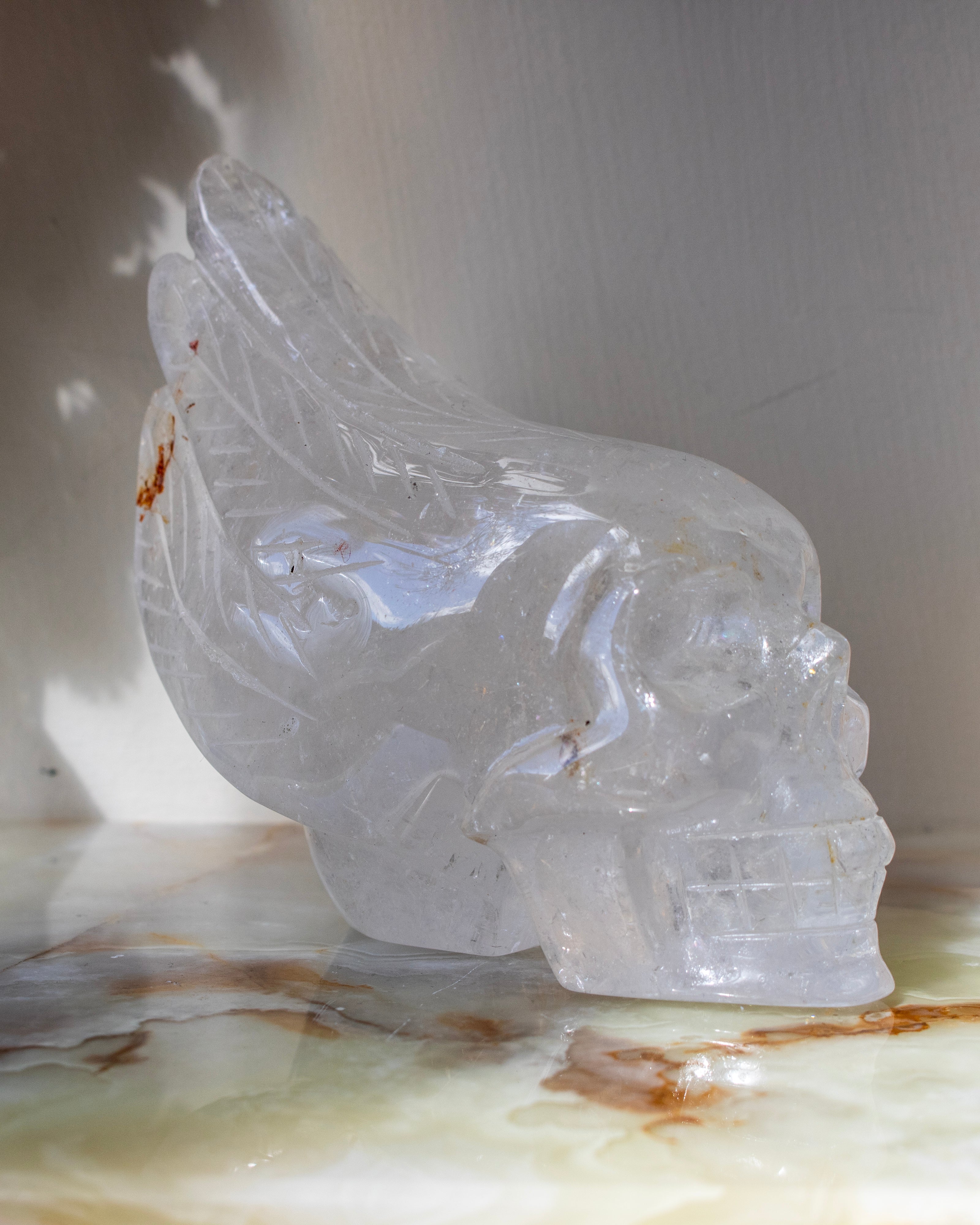 Crystal skull sculpture on a marble surface