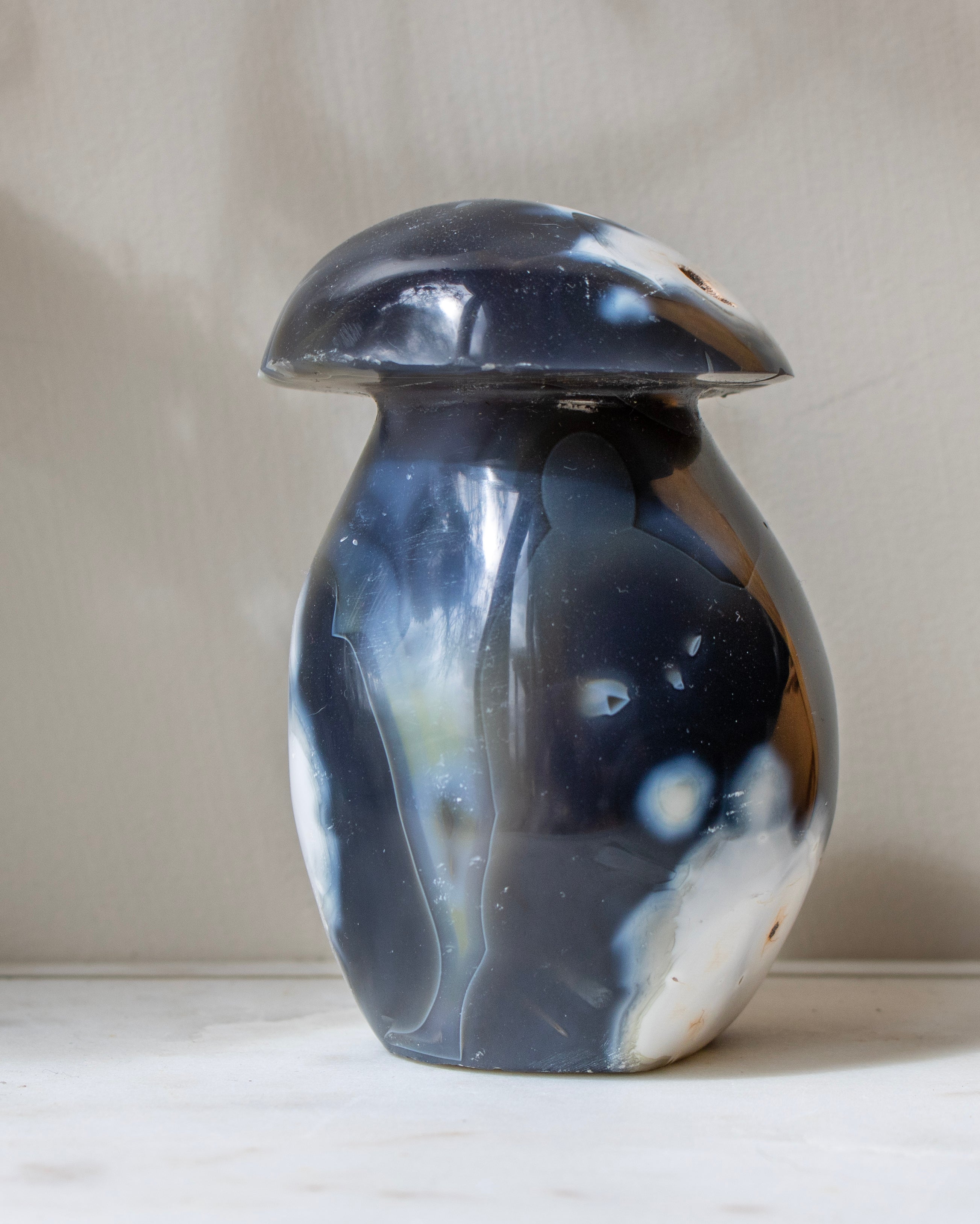 Black and white agate on a light surface with a neutral background