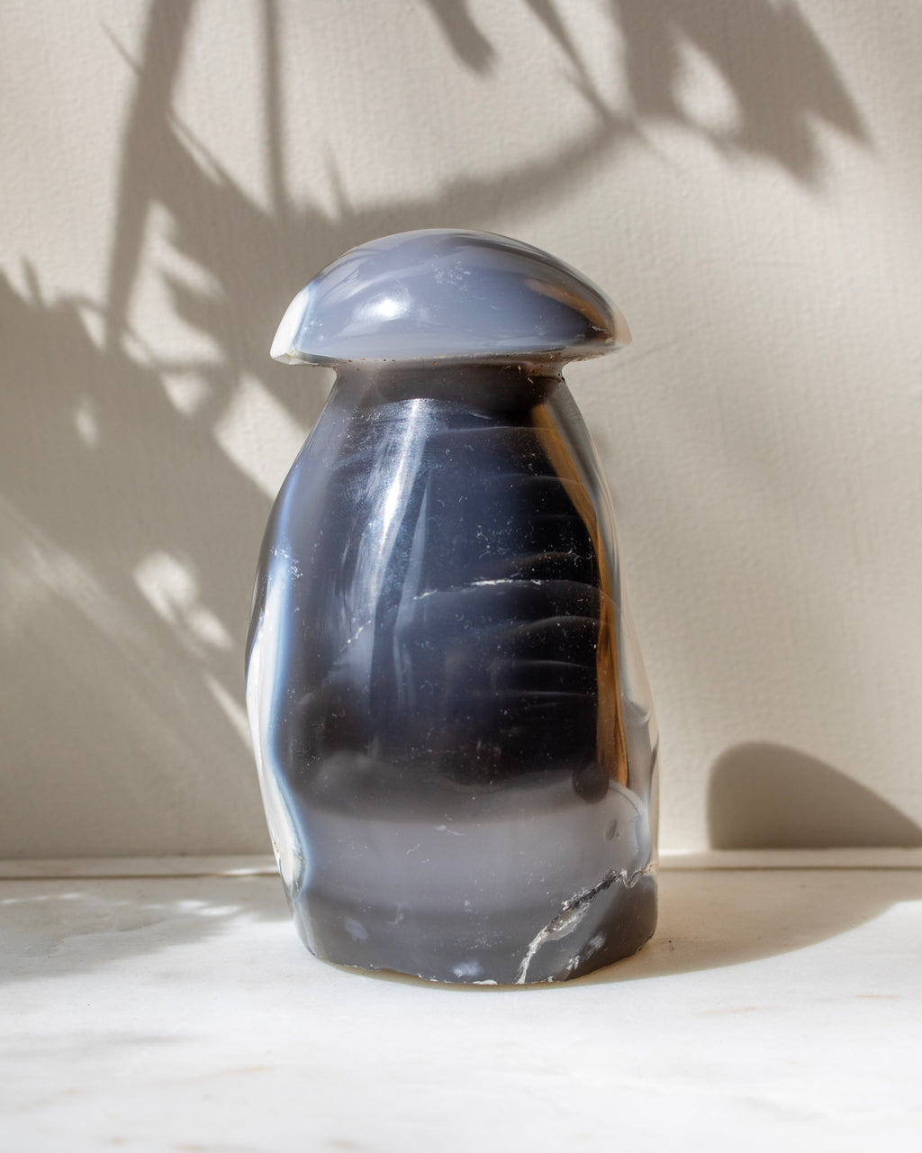 Dark agate stone on a light surface