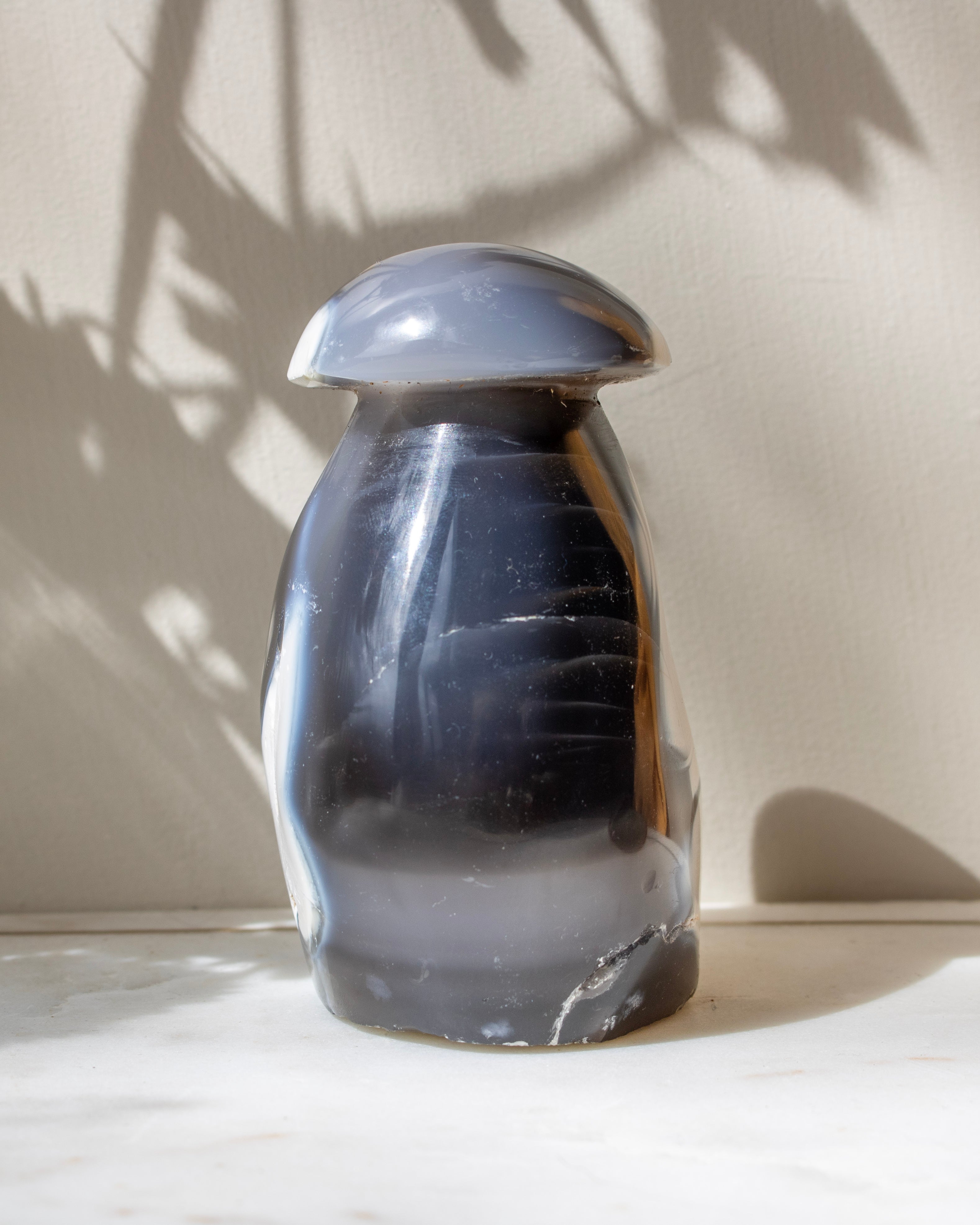 Dark agate stone on a light surface