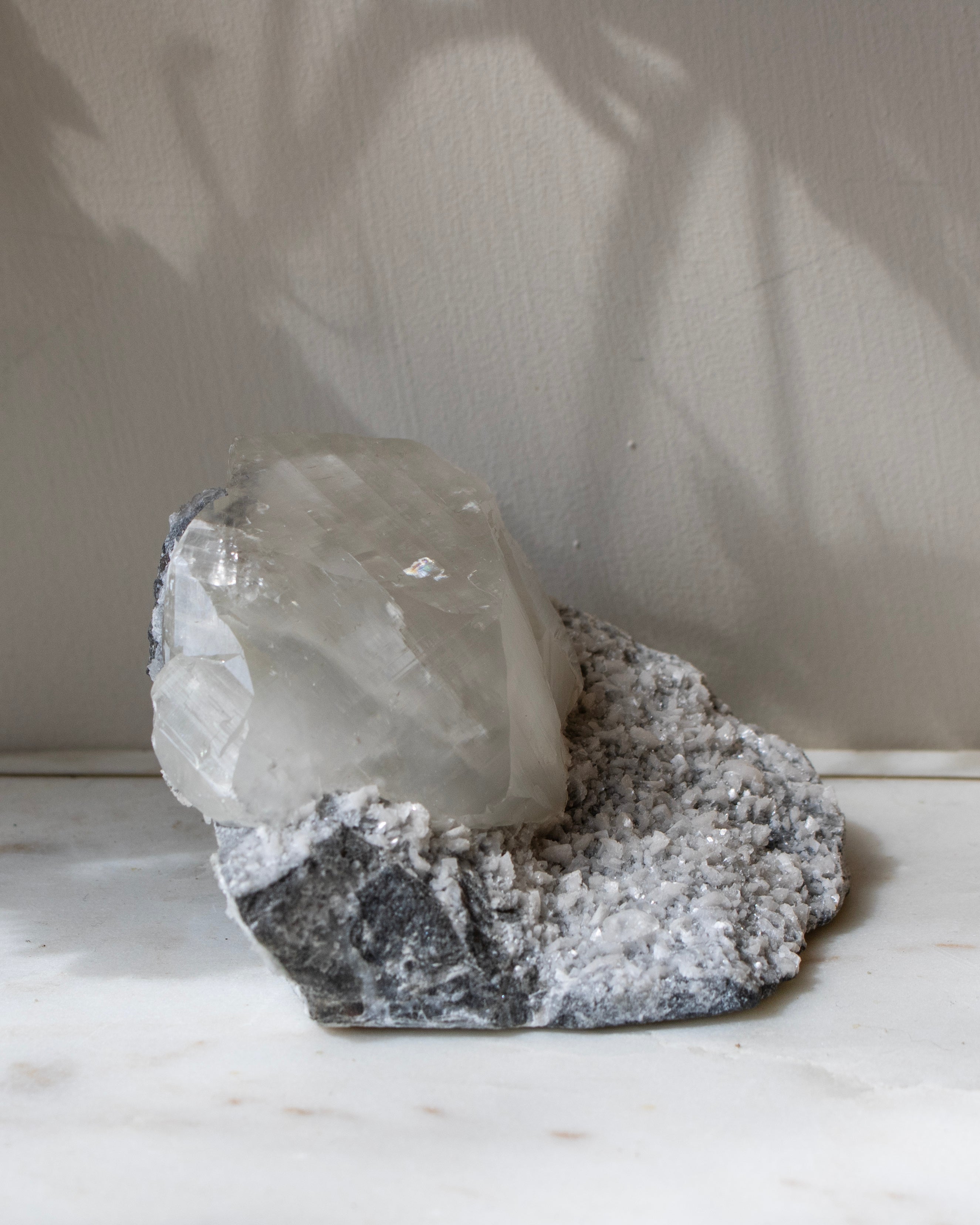 Crystal on a rock with a white background