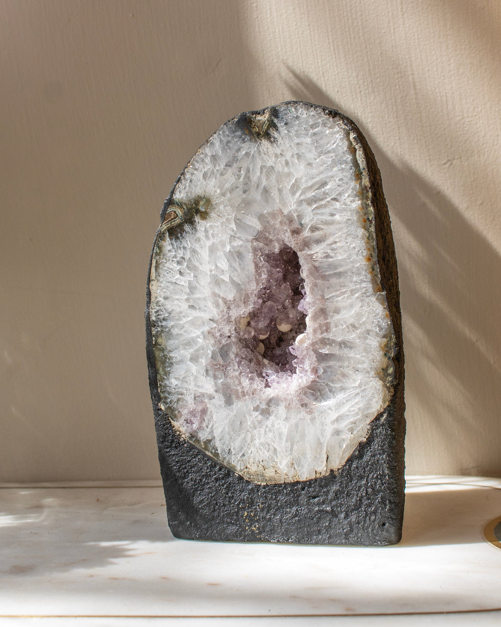 Geode with crystal interior on a neutral background