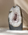 Geode with crystal interior on a neutral background