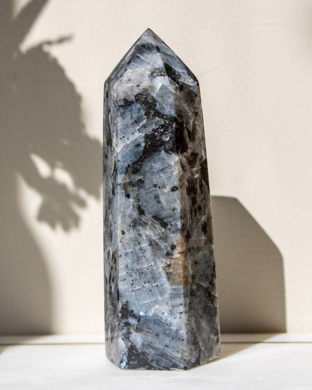 Decorative crystal tower on a neutral background