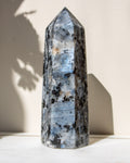 Crystal tower with a natural pattern on a white surface