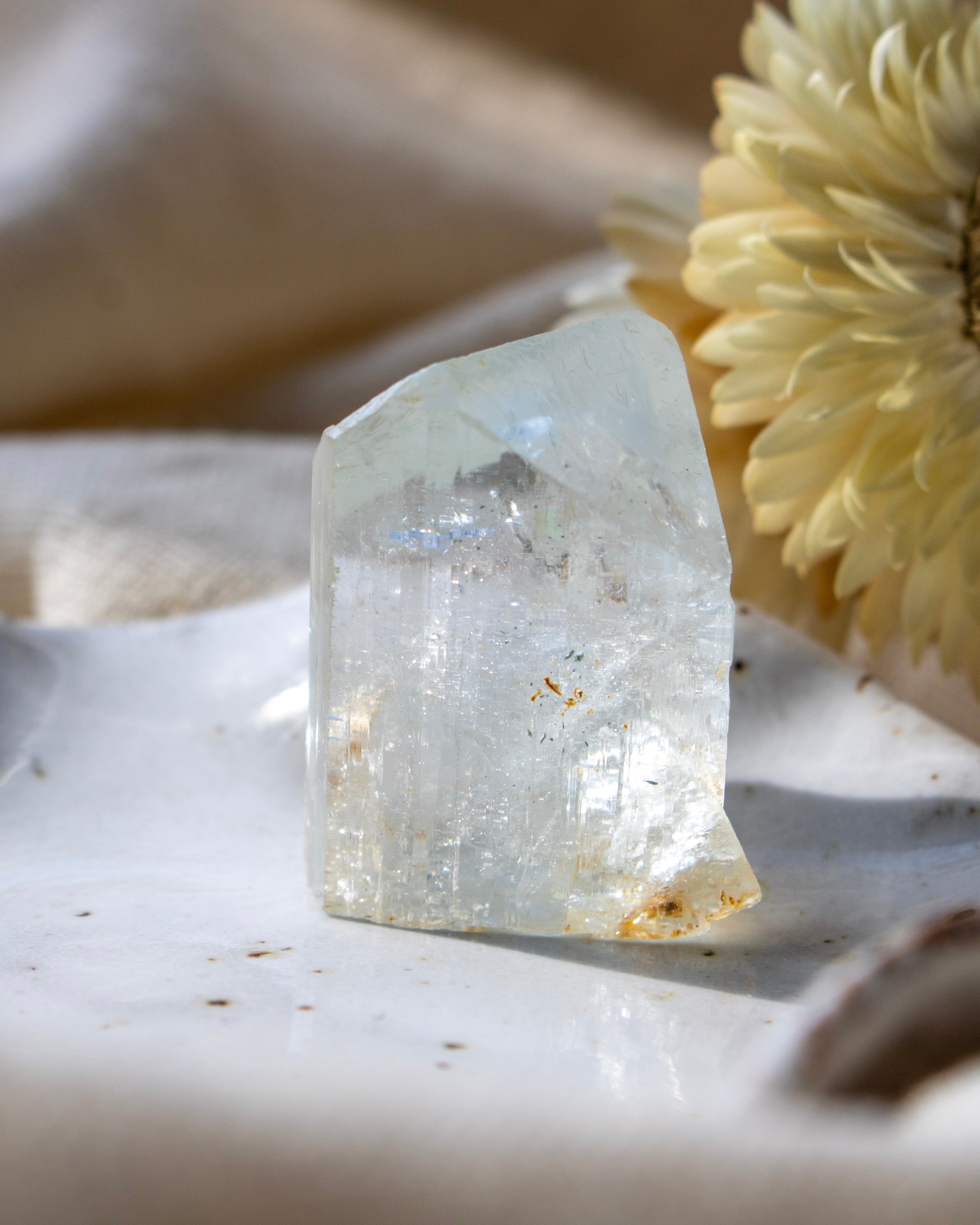 Clear crystal on a textured white surface