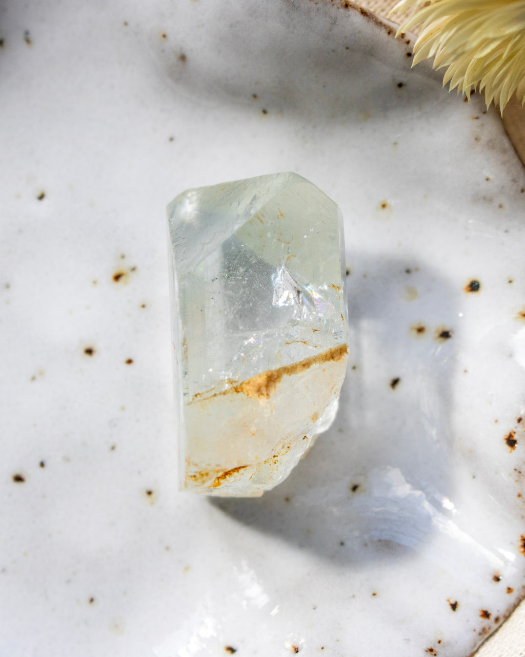 Clear crystal on a textured white surface