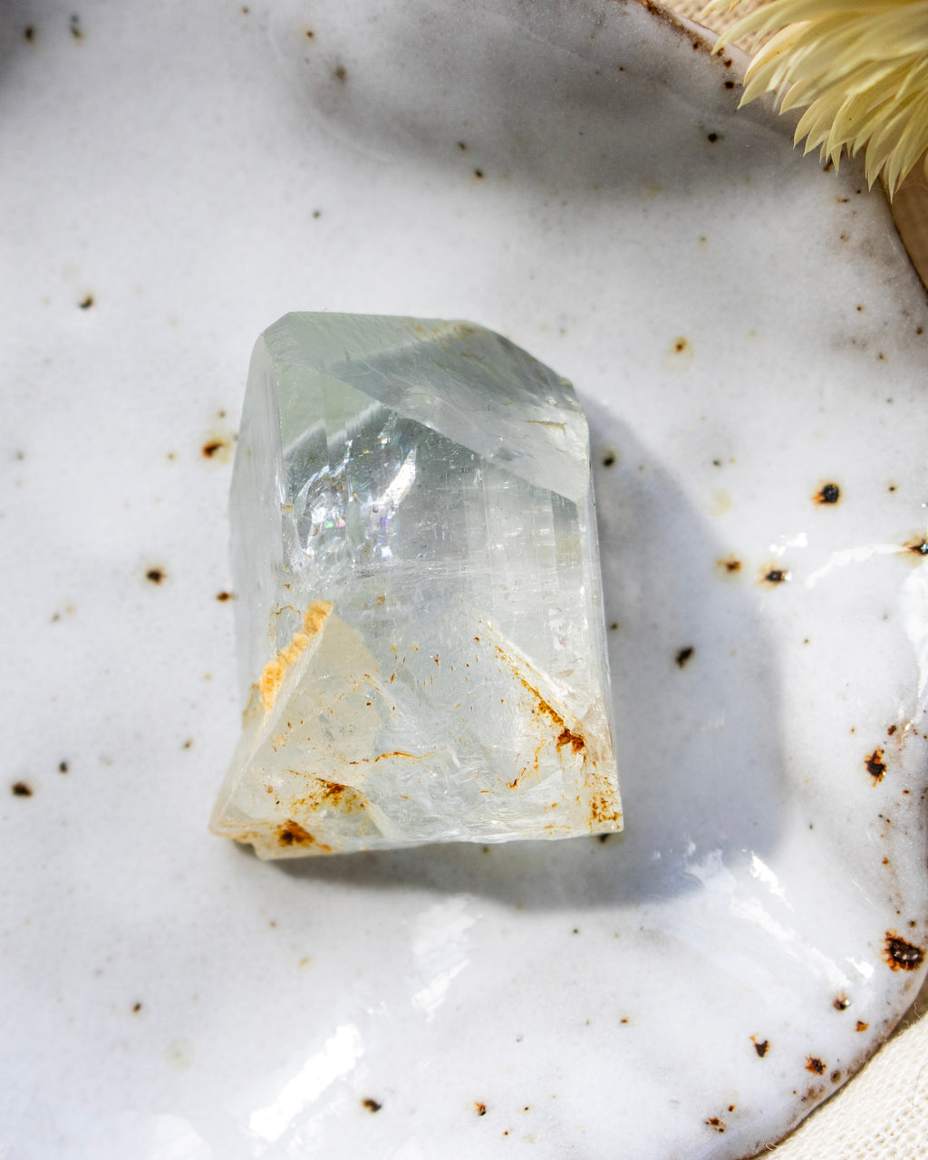 Clear crystal on a textured white surface