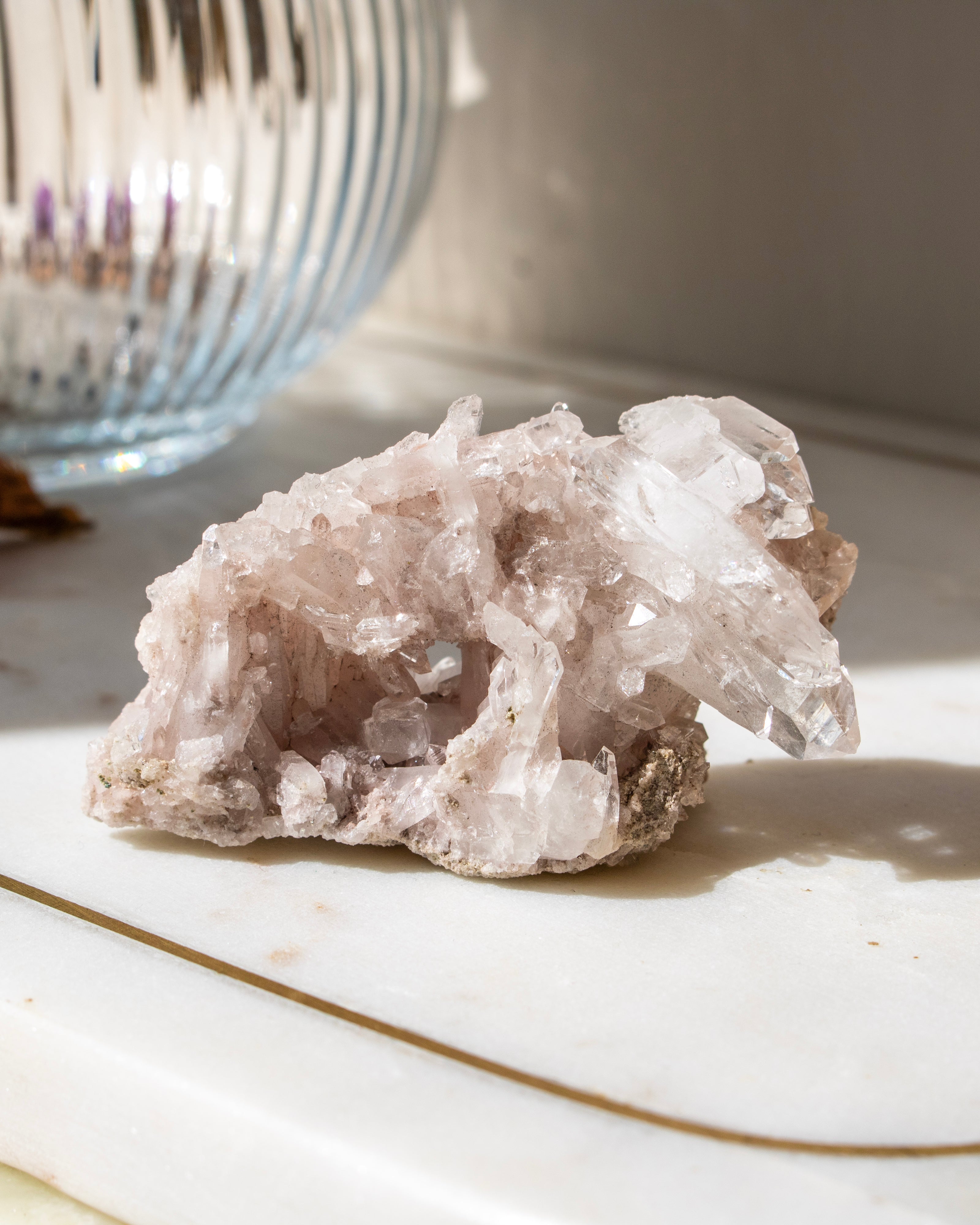 A clear crystal with a blurred natural background