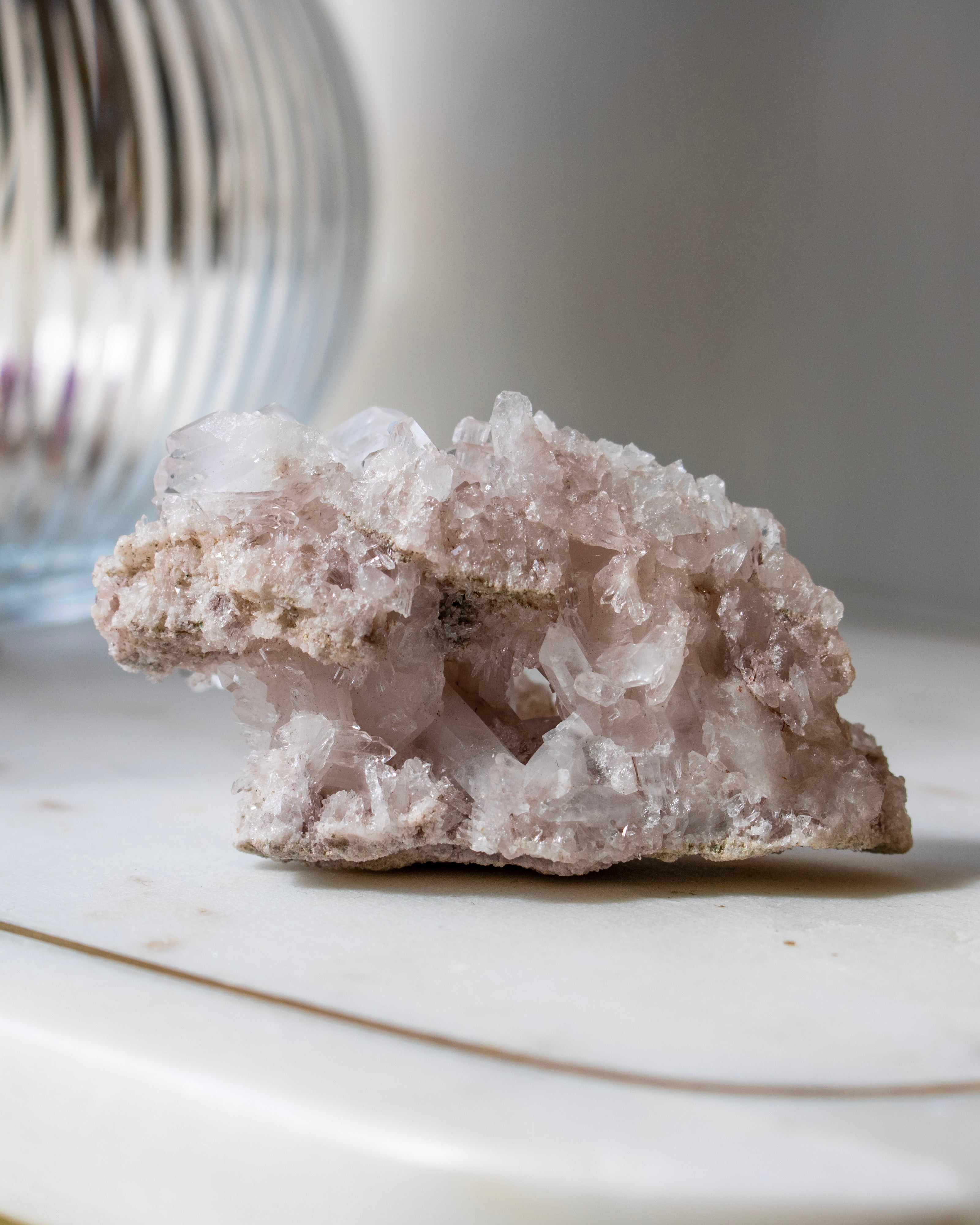 A clear crystal with a blurred natural background